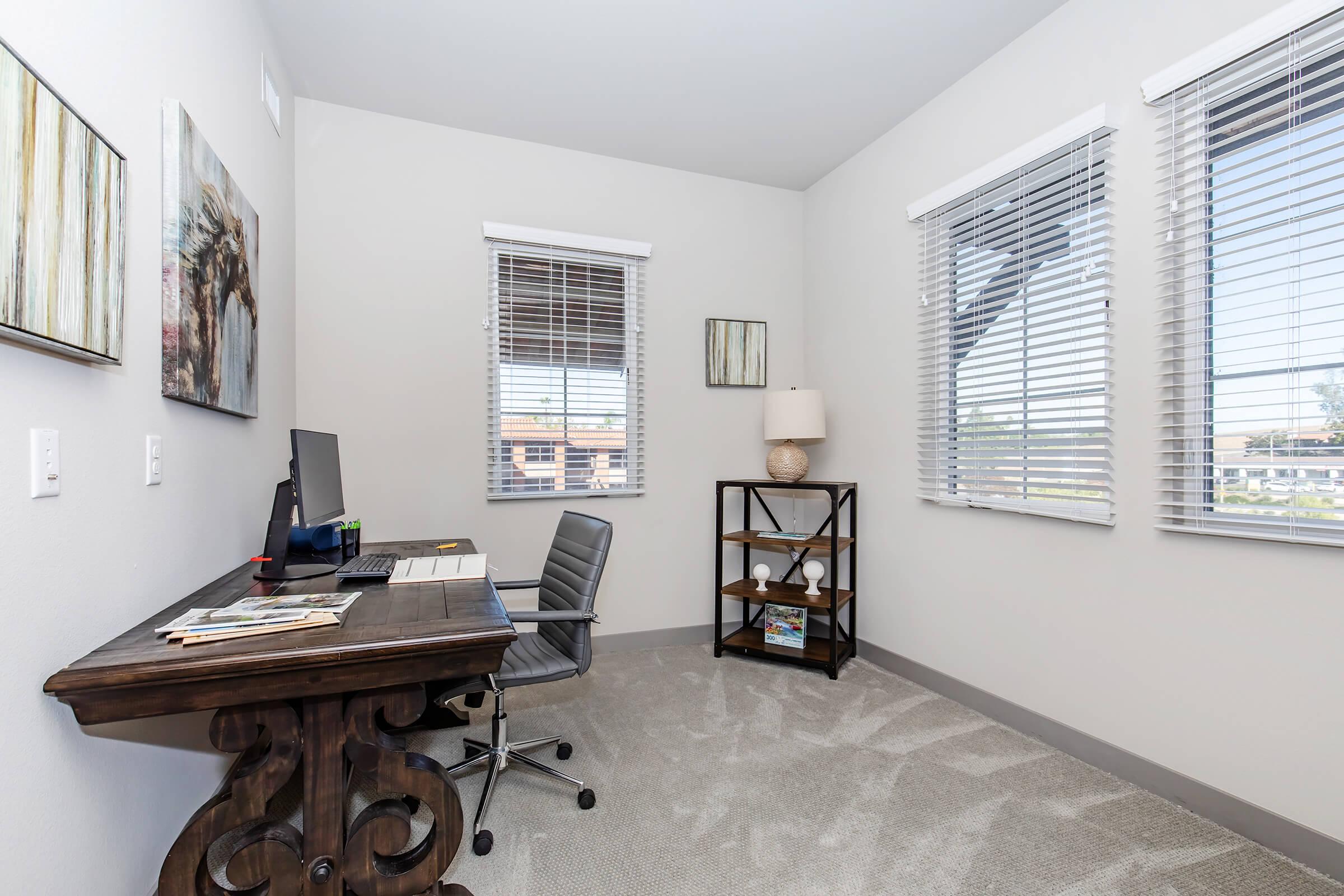 a room filled with furniture and a large window