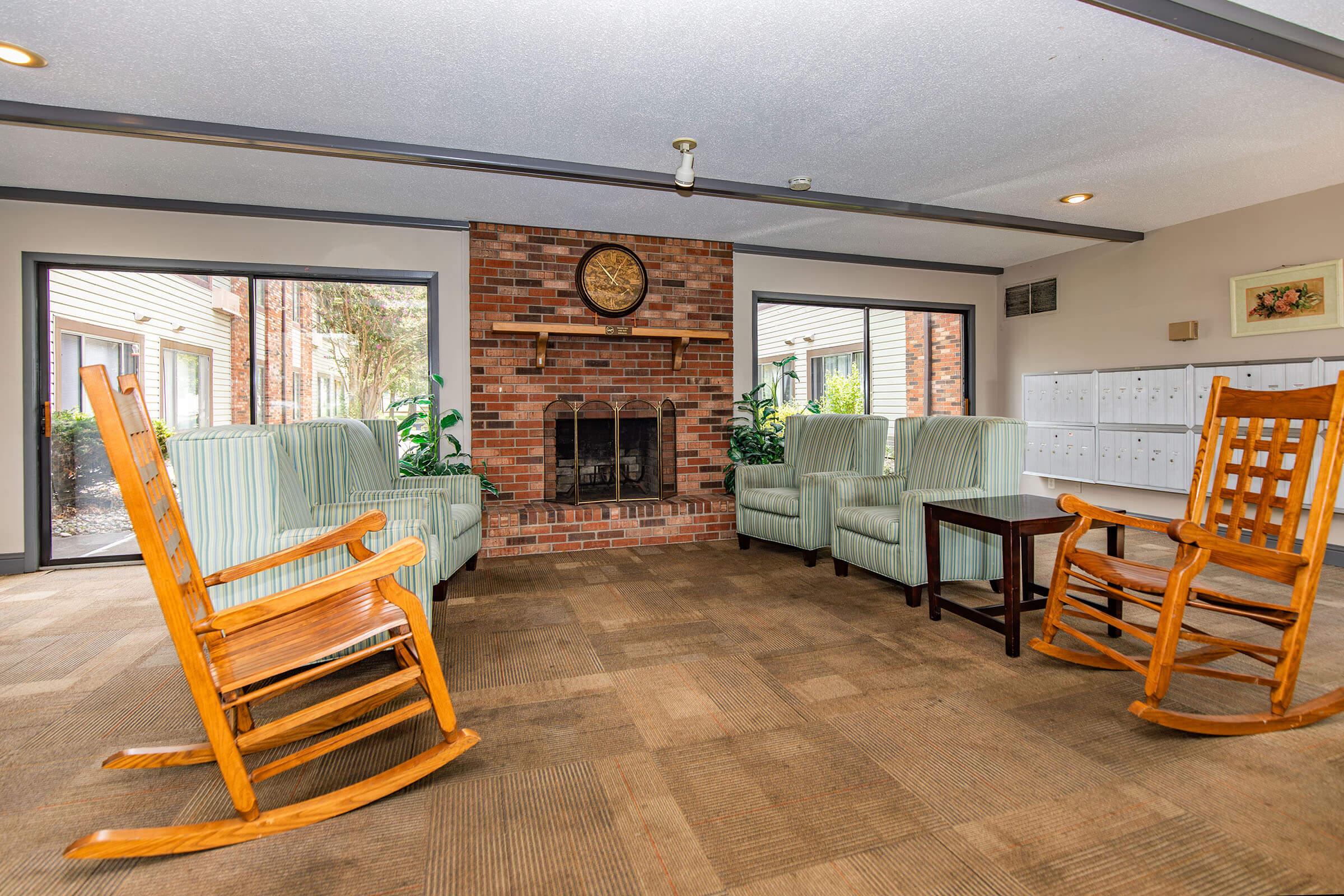 a living room filled with furniture and a fireplace