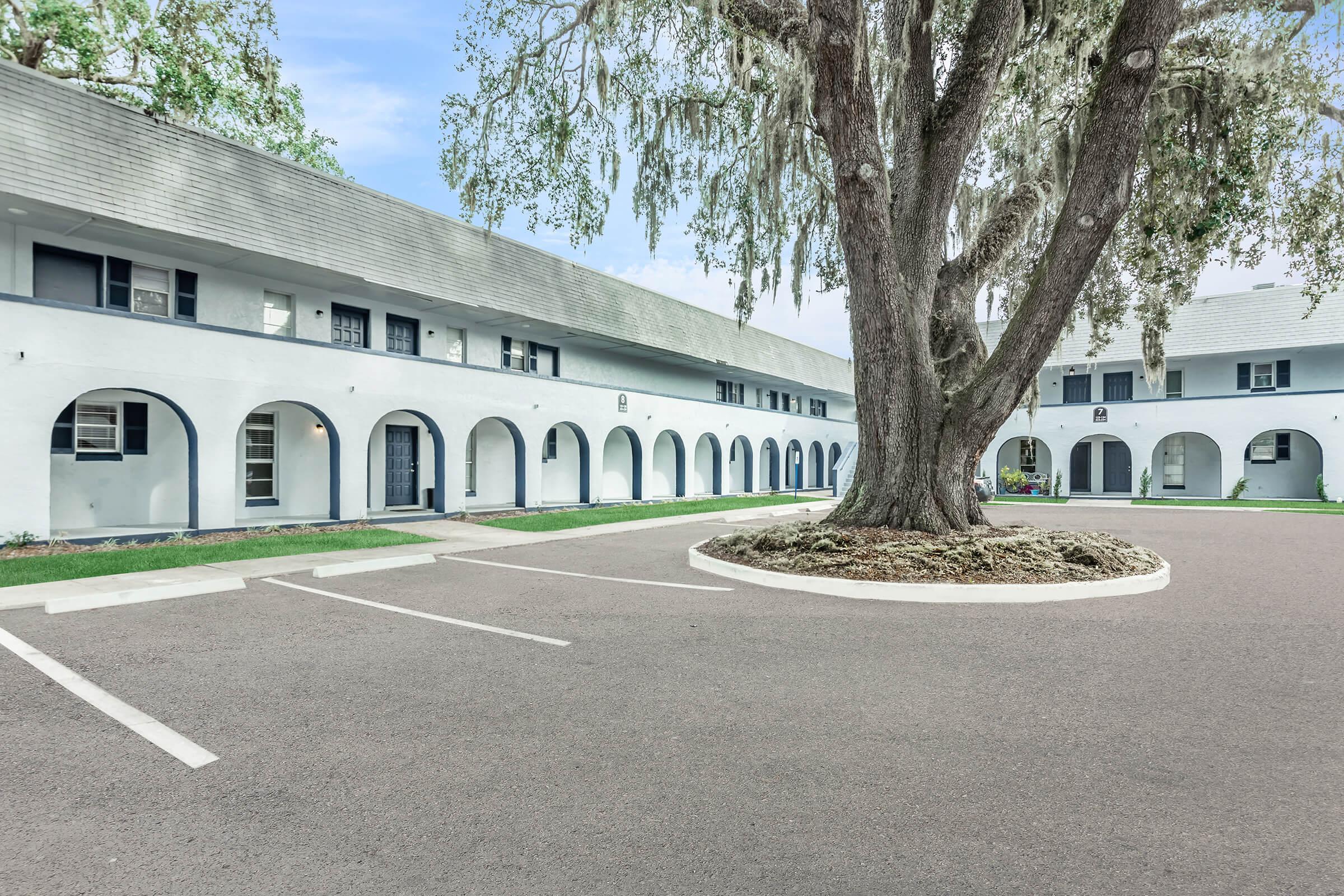 a road with a building in the background