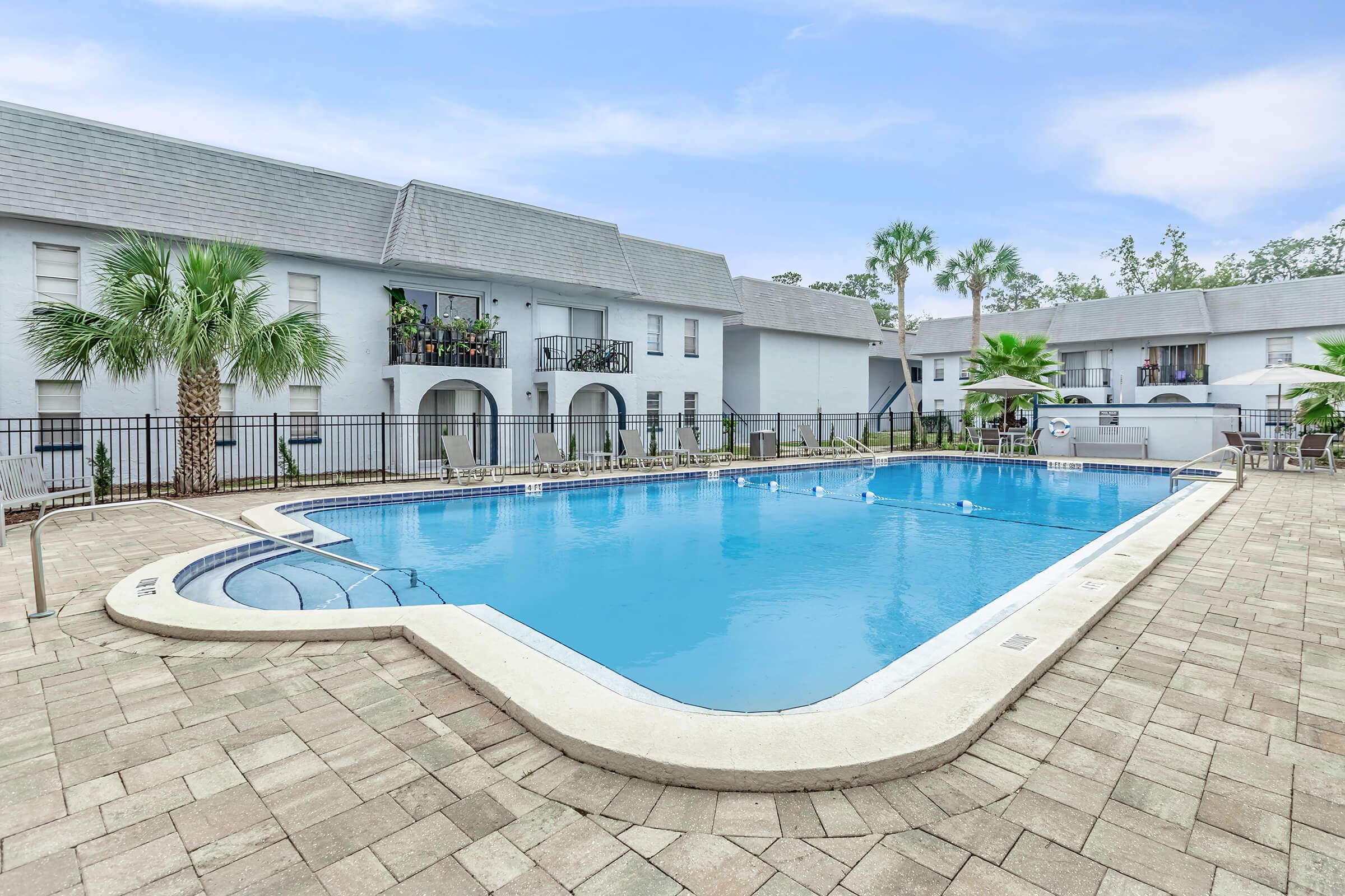 a house with a large pool of water