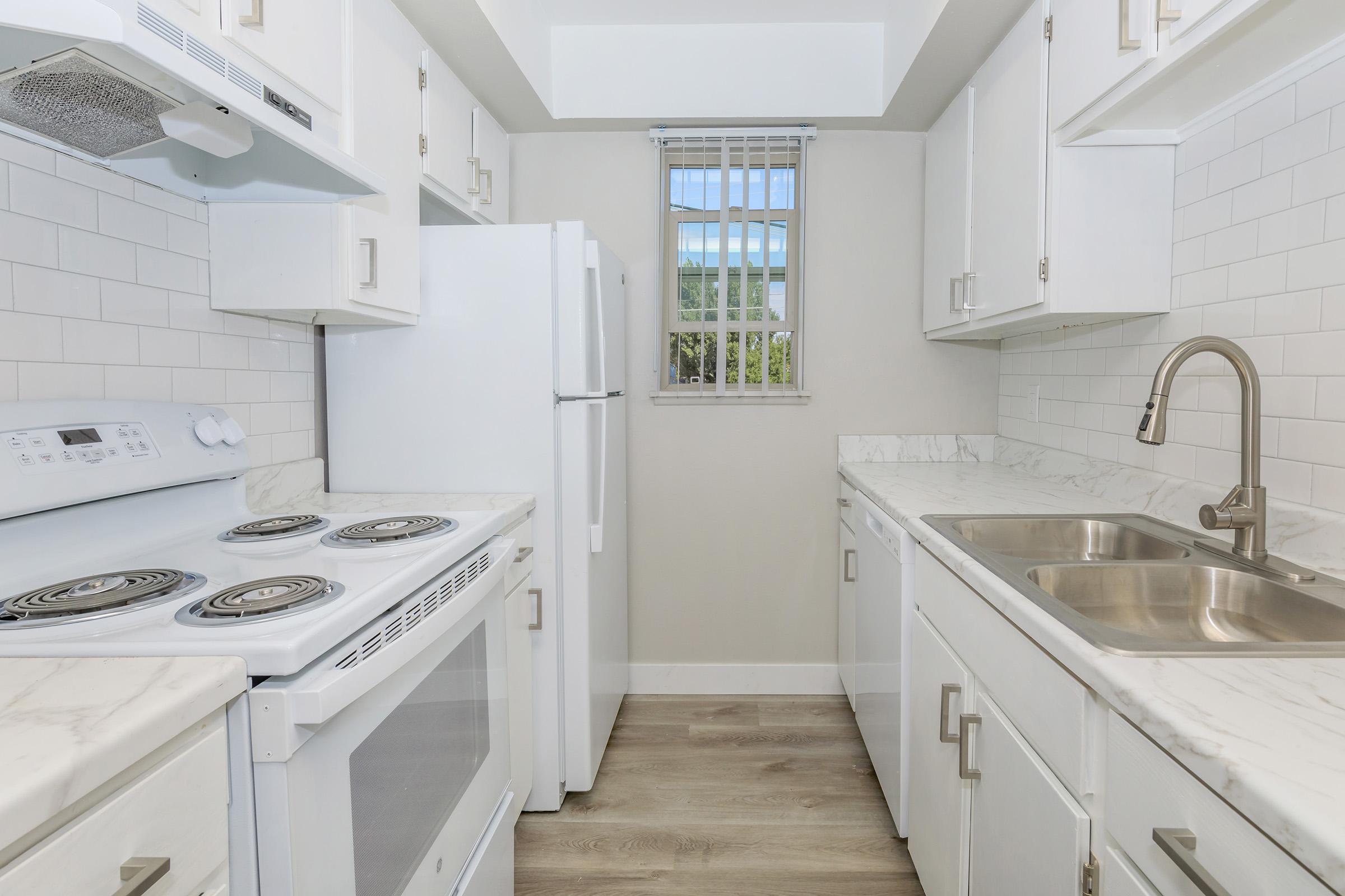 a kitchen with a sink and a window