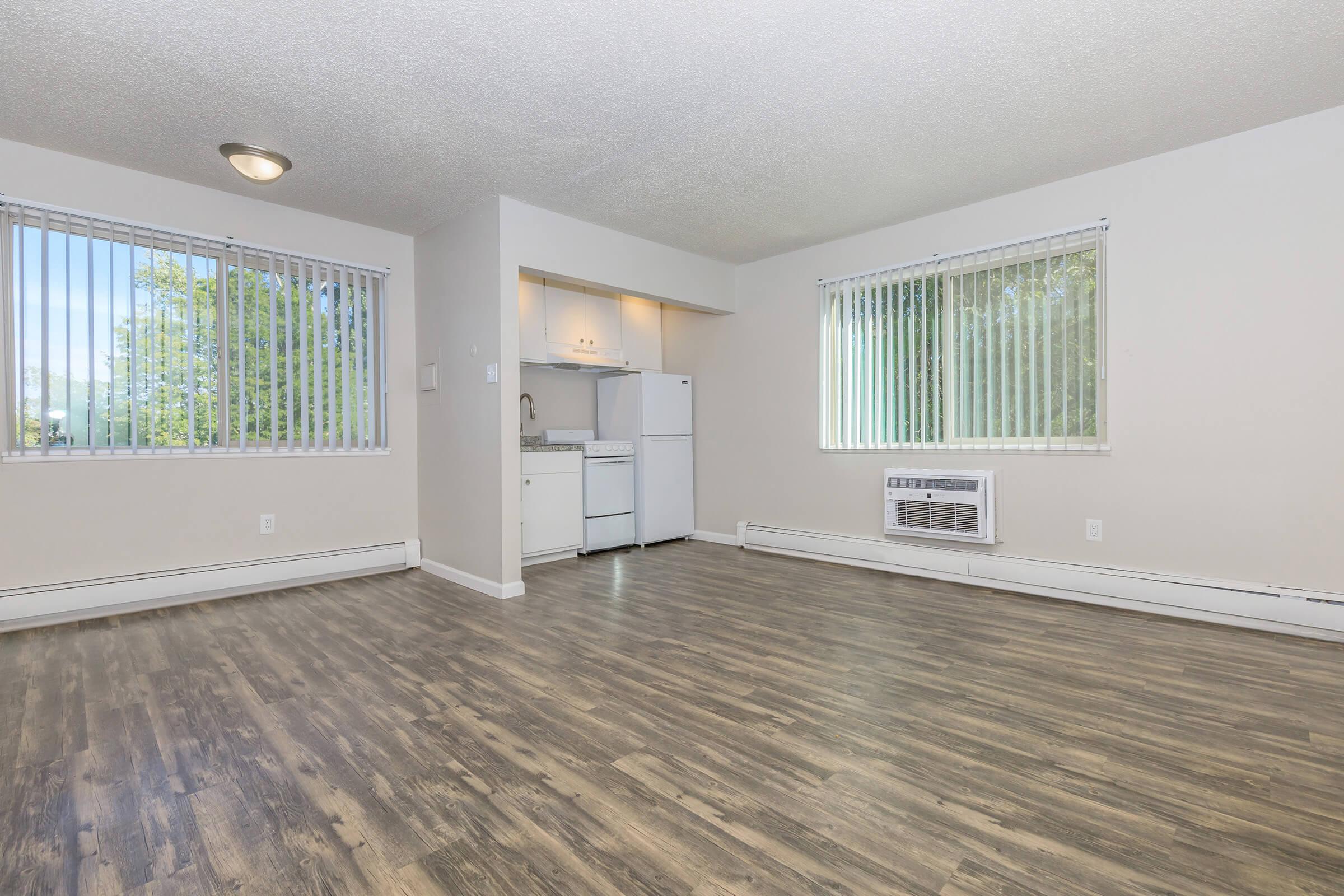 a room filled with furniture and a large window