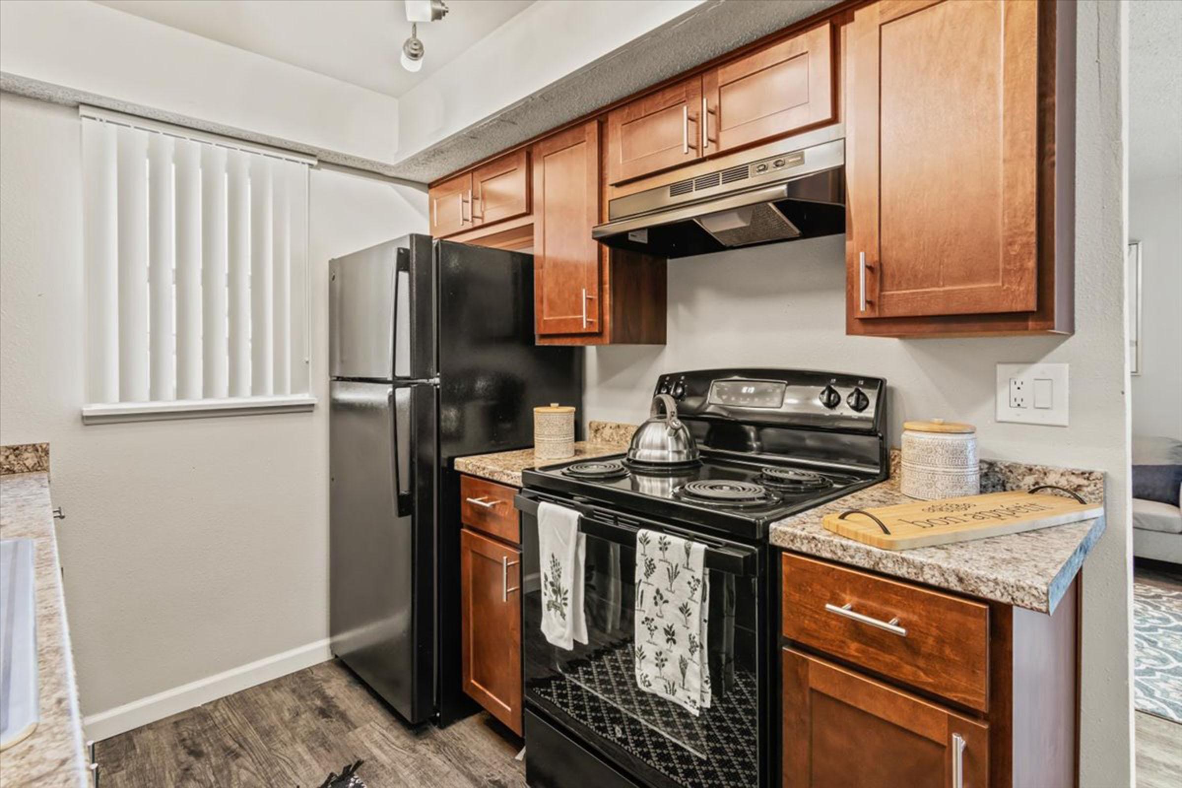 a stove top oven sitting inside of a kitchen