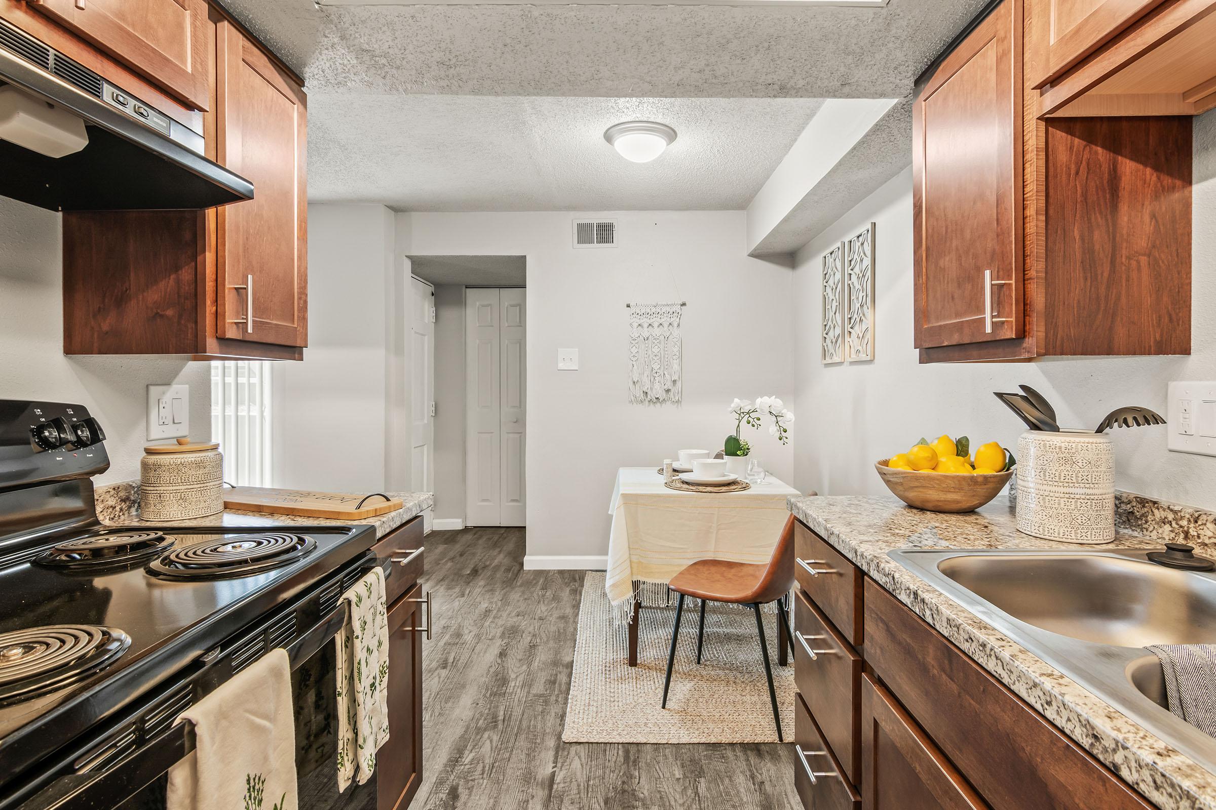 a kitchen with a stove top oven sitting inside of a building