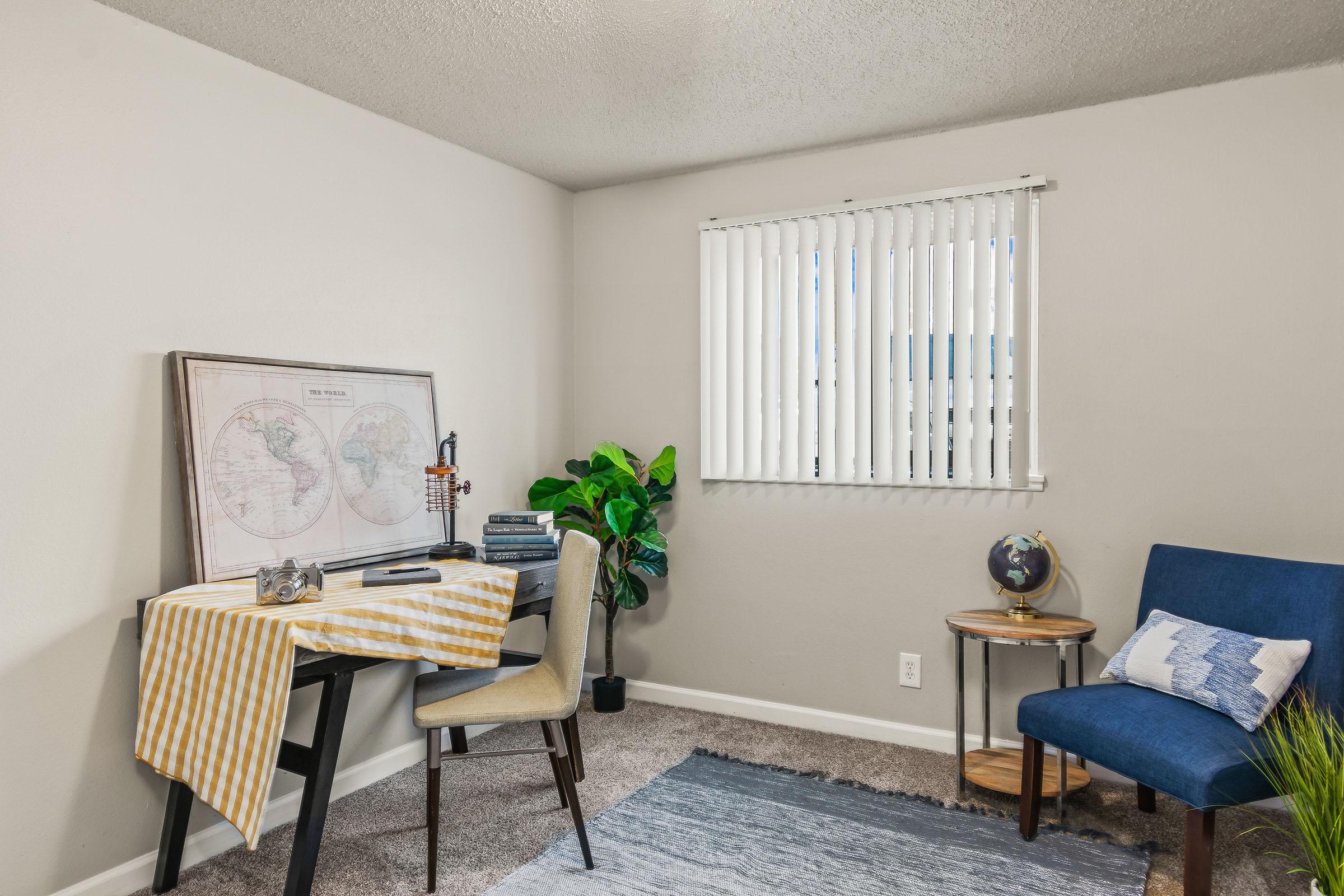 a living room filled with furniture and a tv