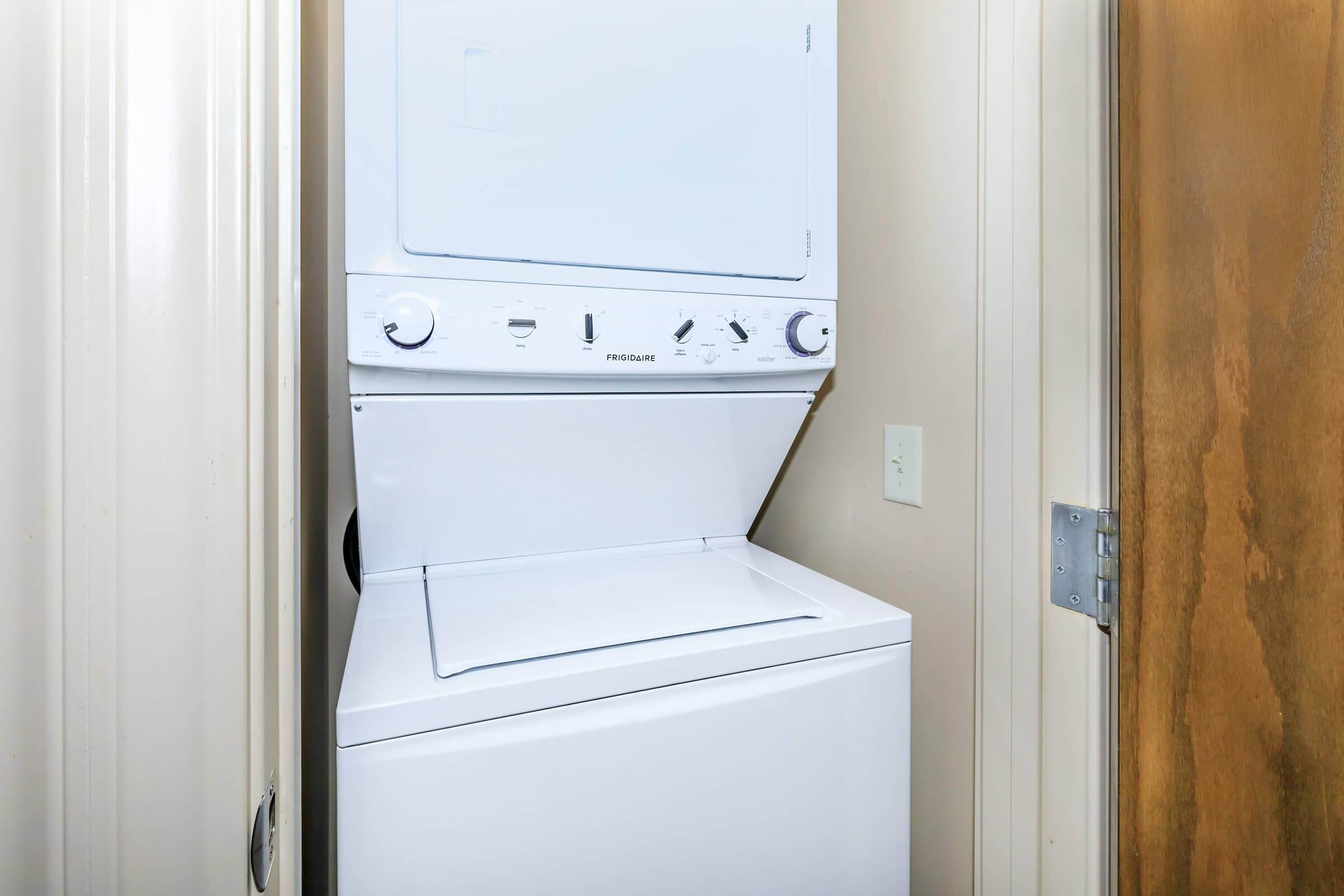 a refrigerator freezer sitting next to a door