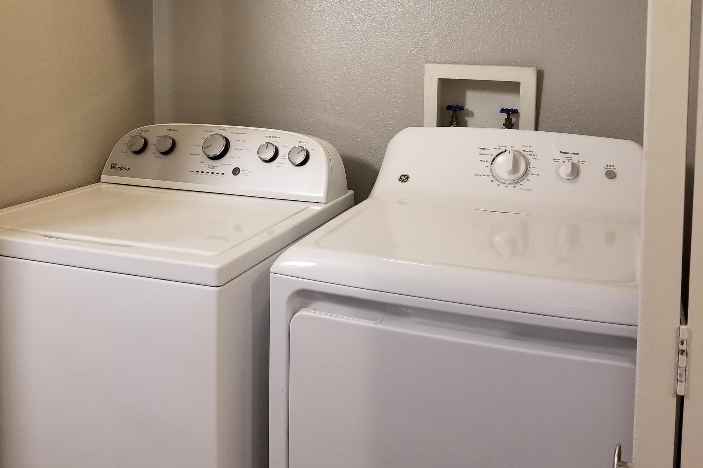 a microwave oven sitting on top of a refrigerator