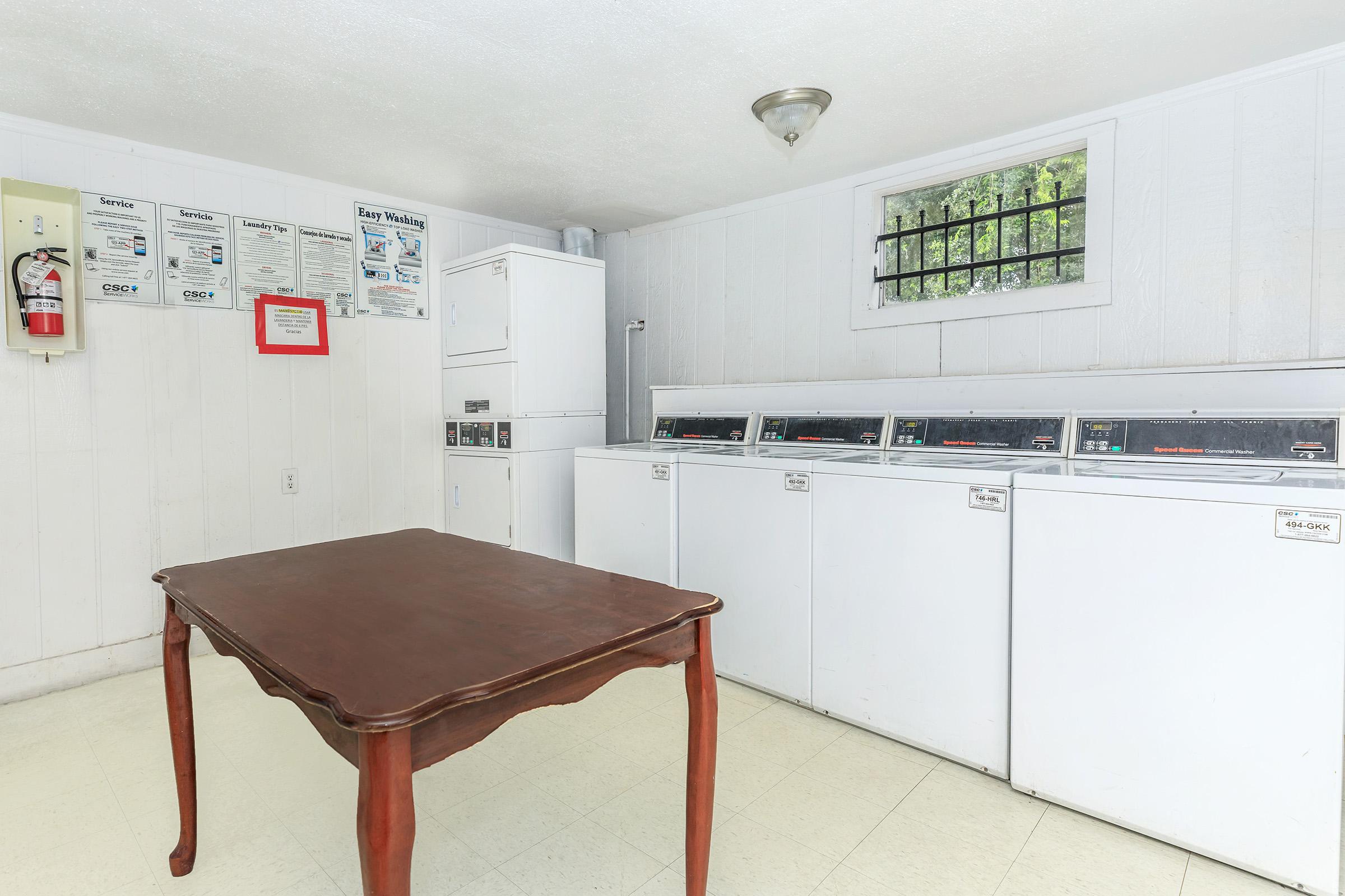 a kitchen with a table in a room