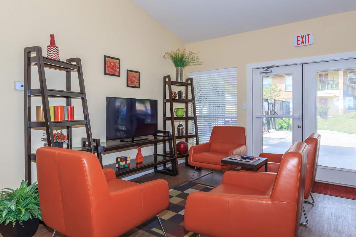a large red chair in the living room