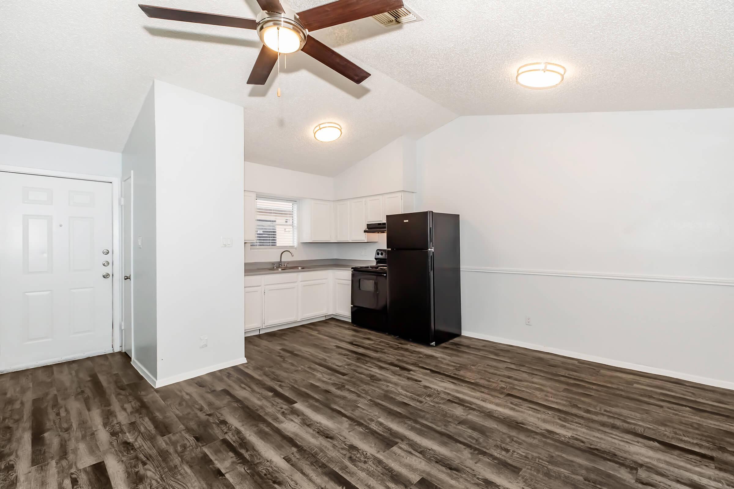 a kitchen with a wood floor