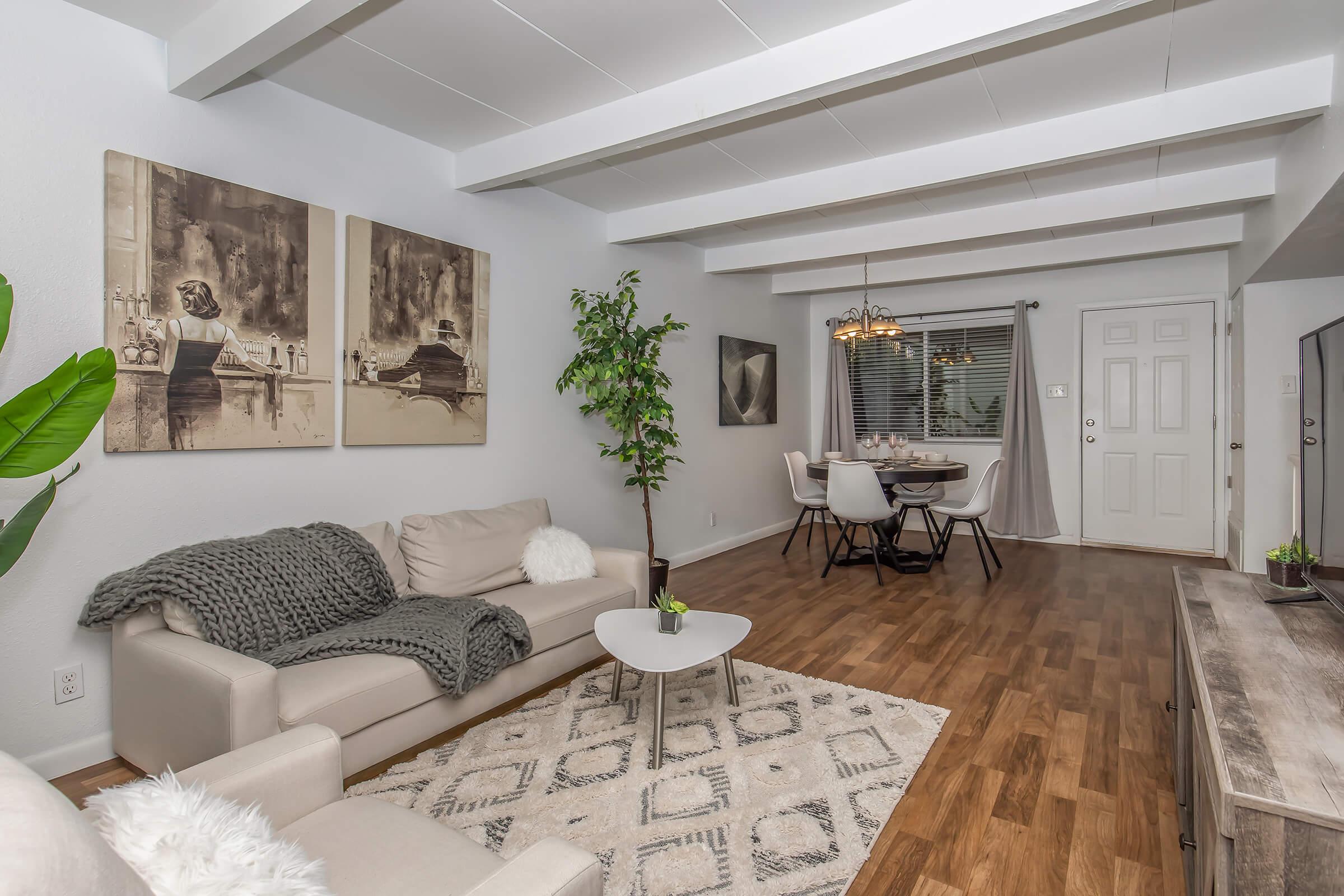 a living room filled with furniture and a fireplace