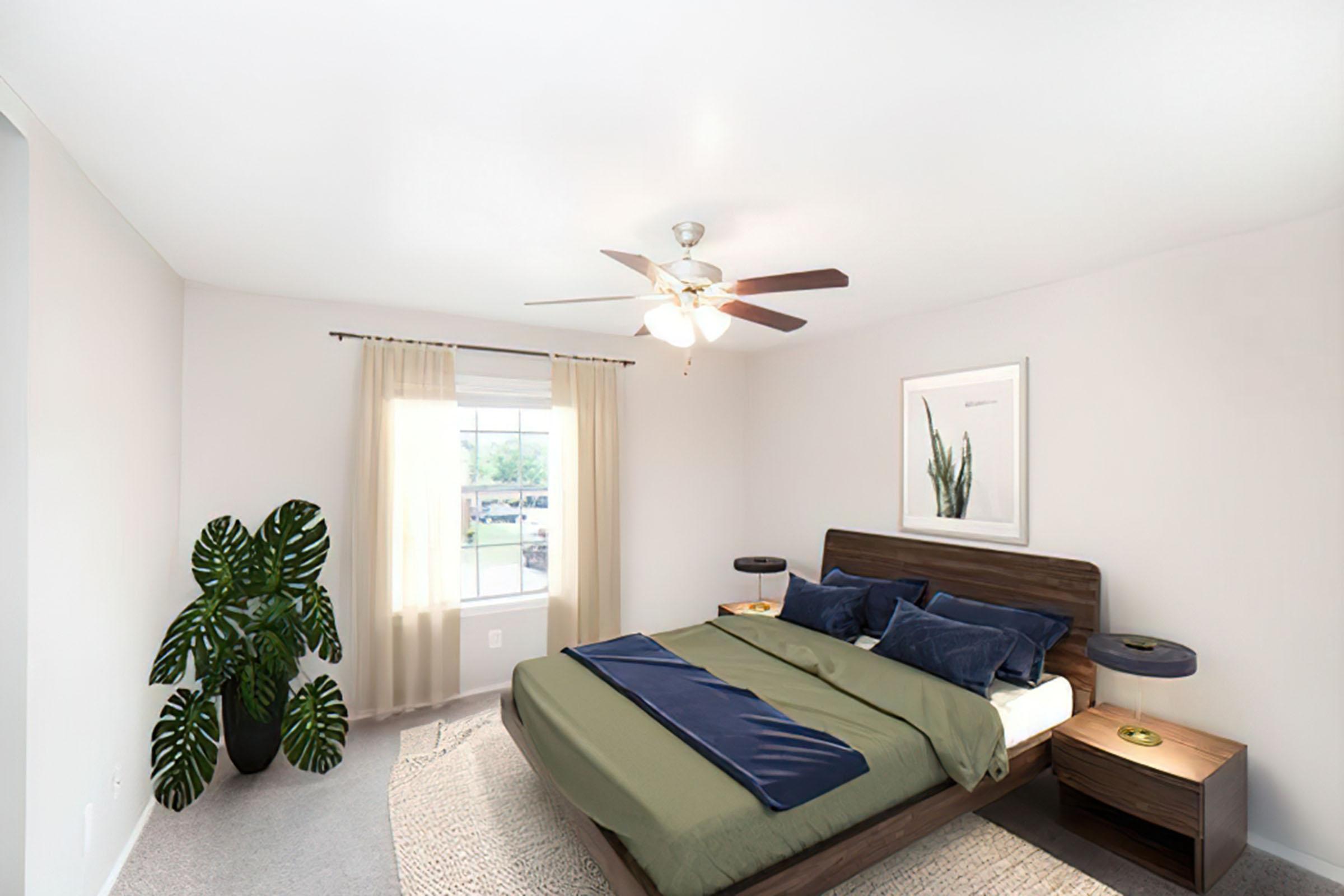 a living room filled with furniture and a large window