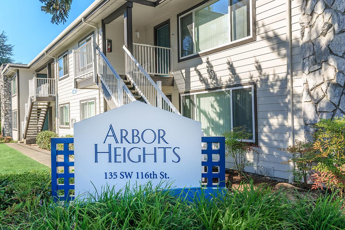 a house that has a sign on the side of a building