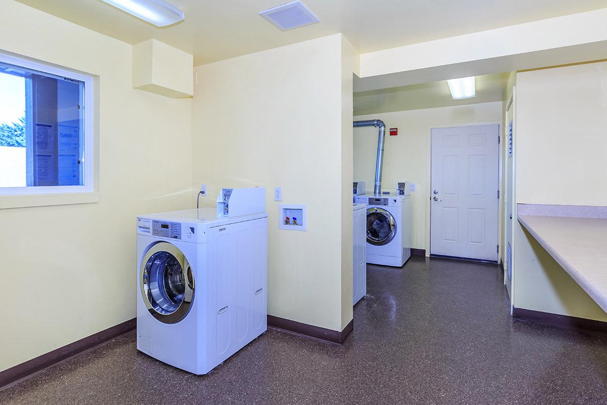 a white refrigerator freezer sitting in a room