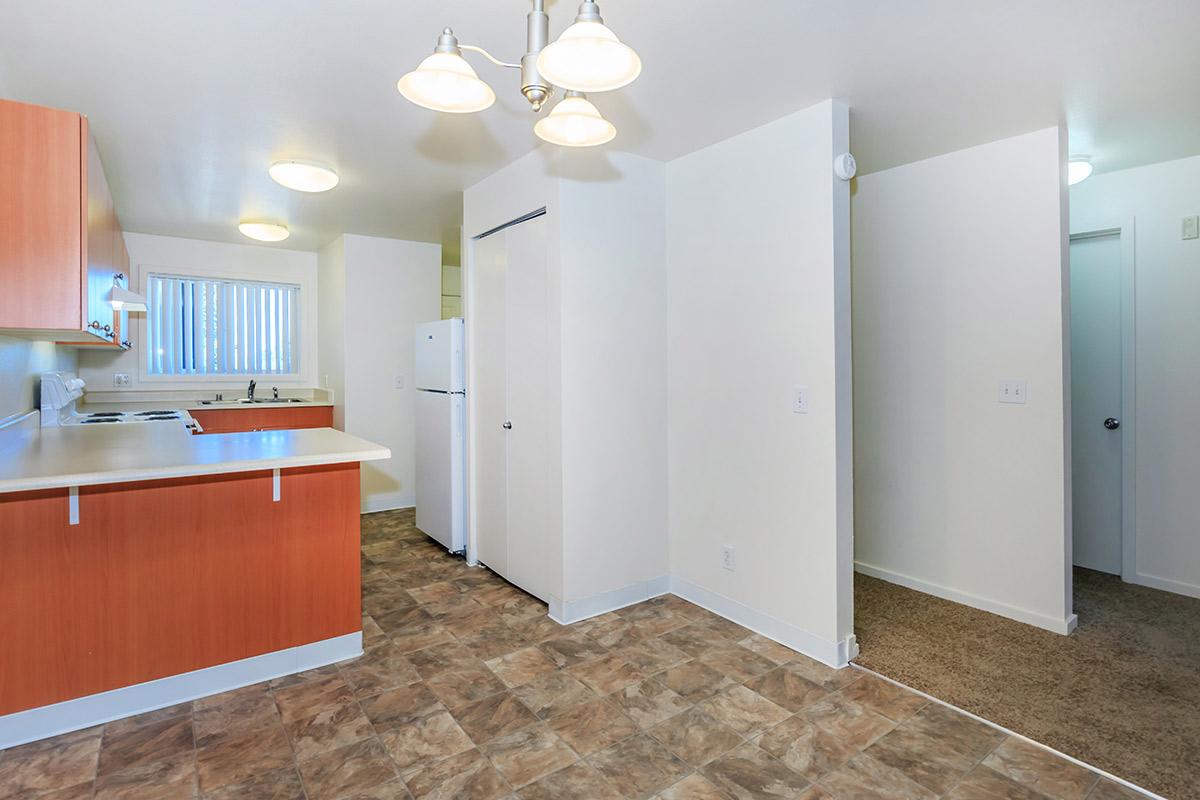 a kitchen with a sink and a refrigerator