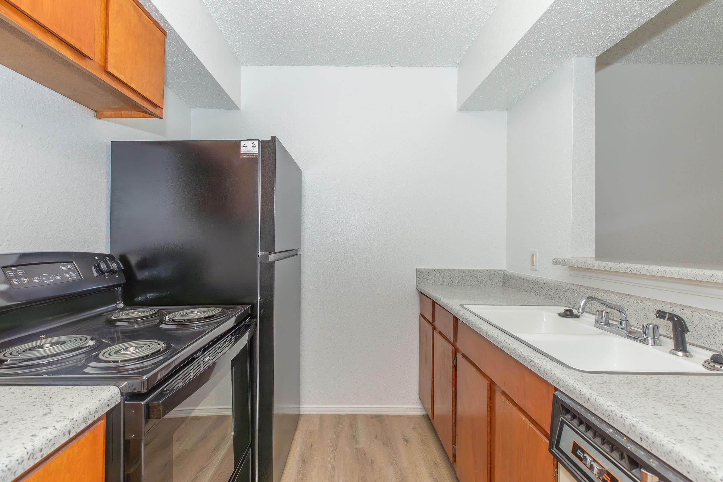 a kitchen with a stove and a sink