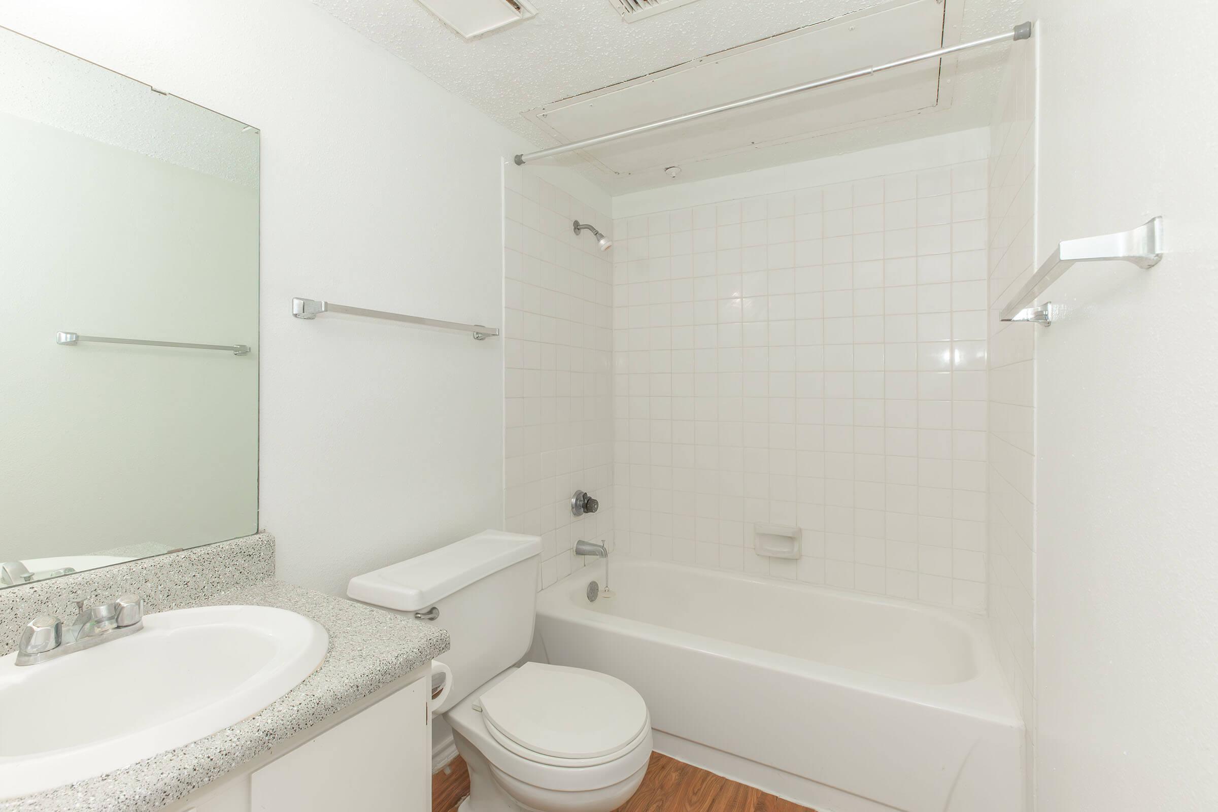 a room with a sink and a bath tub