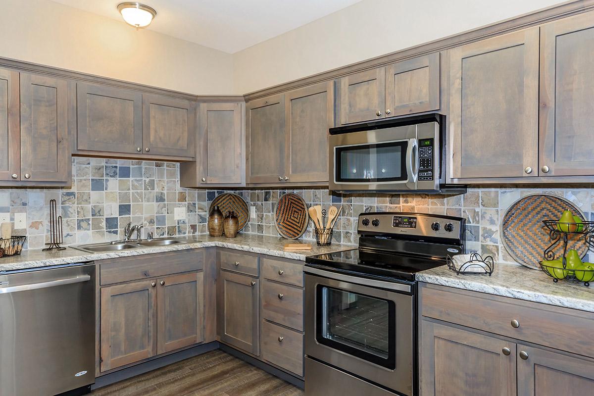 a kitchen with a stove top oven