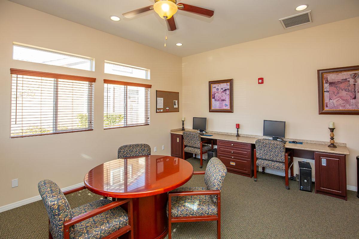 a living room filled with furniture and a large window