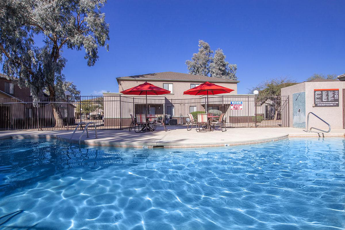 SOAK UP THE SUN BY THE SHIMMERING SWIMMING POOL