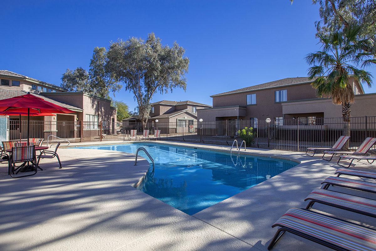 a house with a pool outside of a building