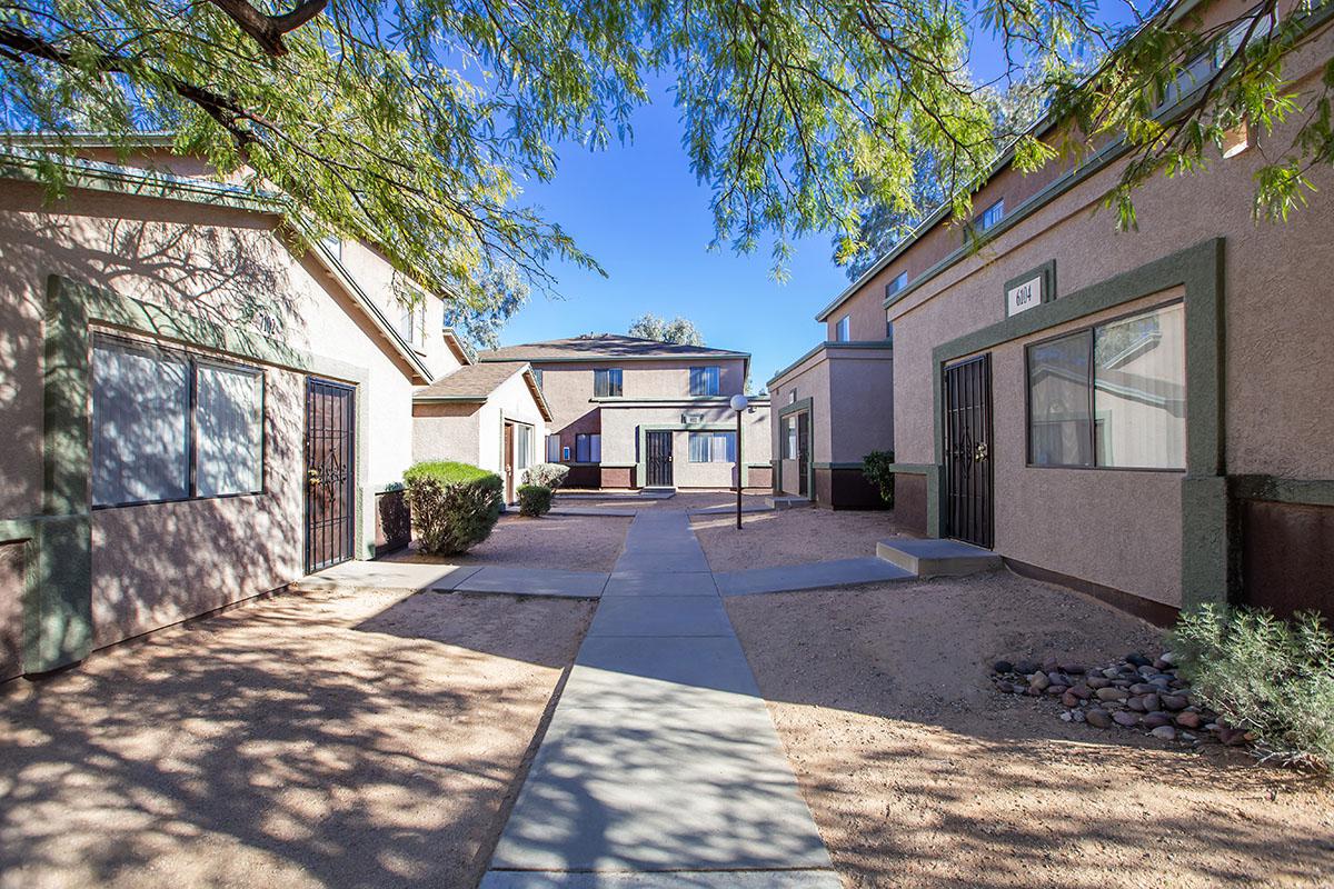 a house in the middle of a sidewalk