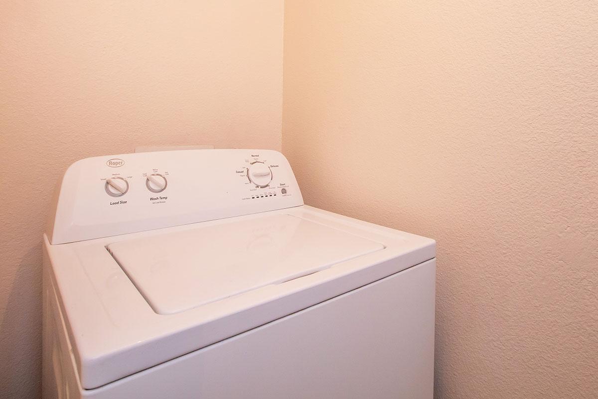 a white refrigerator freezer sitting in a box