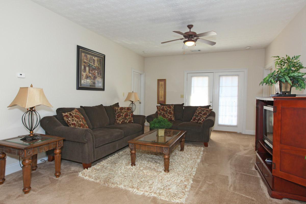 a living room filled with furniture and a fireplace