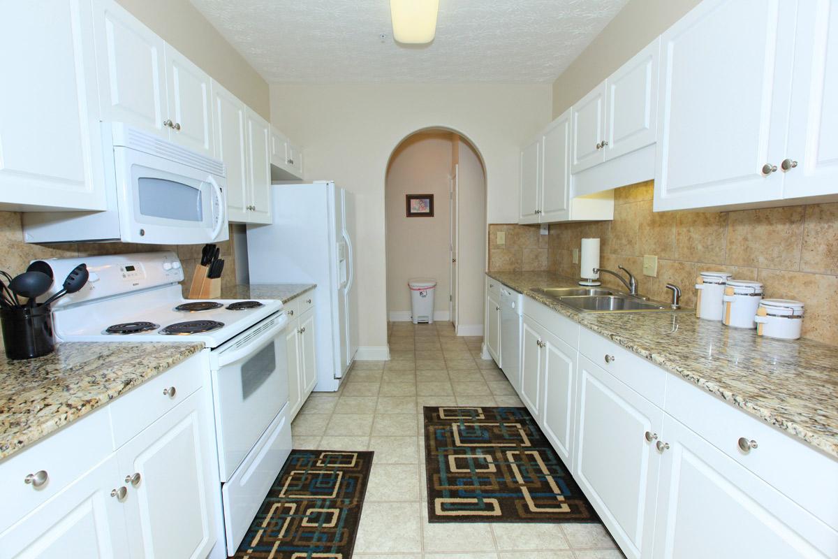 a kitchen with a tile floor