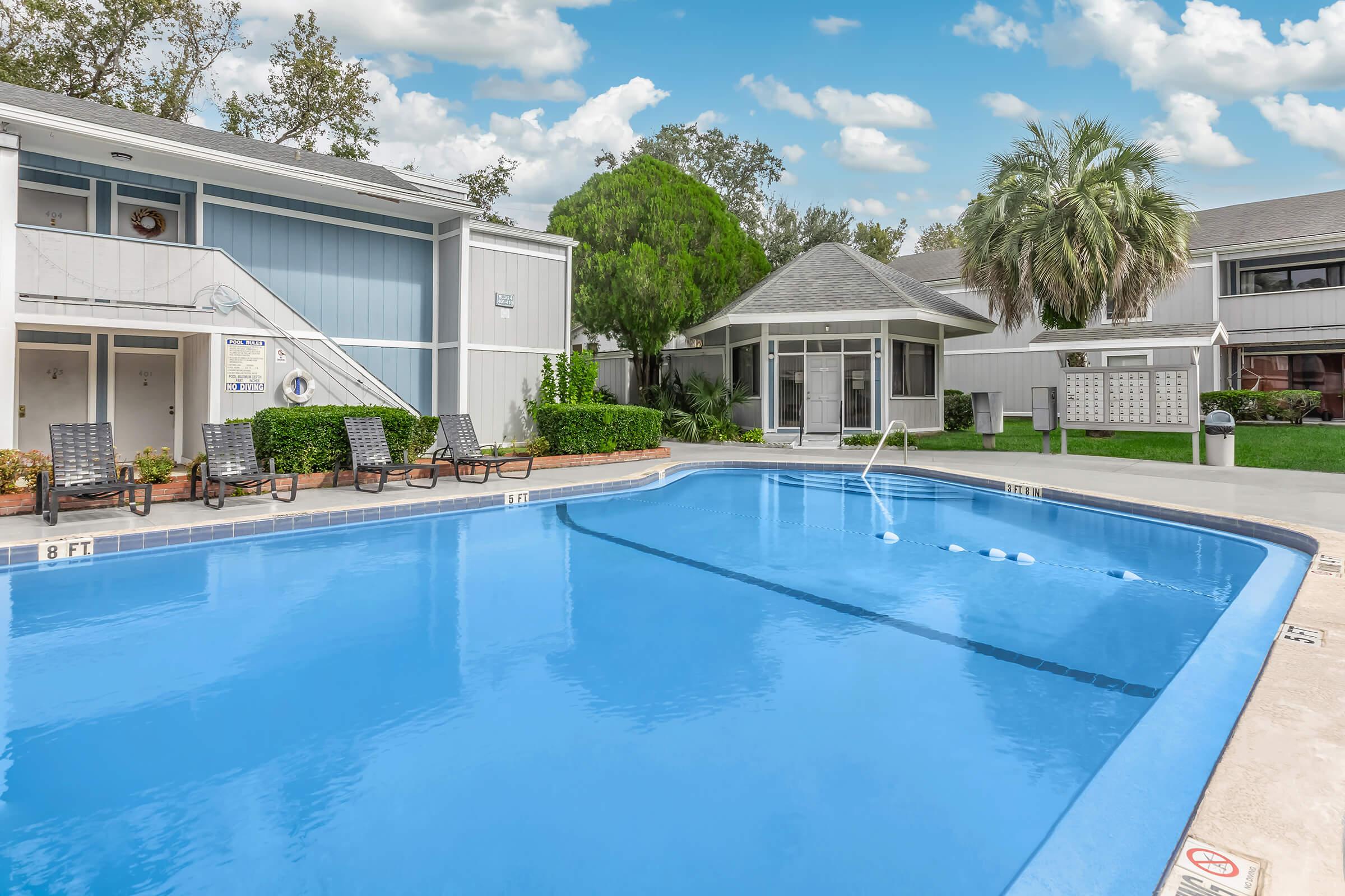 a house with a large pool of water