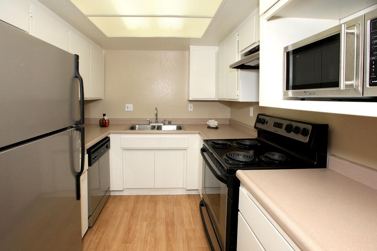 a modern kitchen with stainless steel appliances