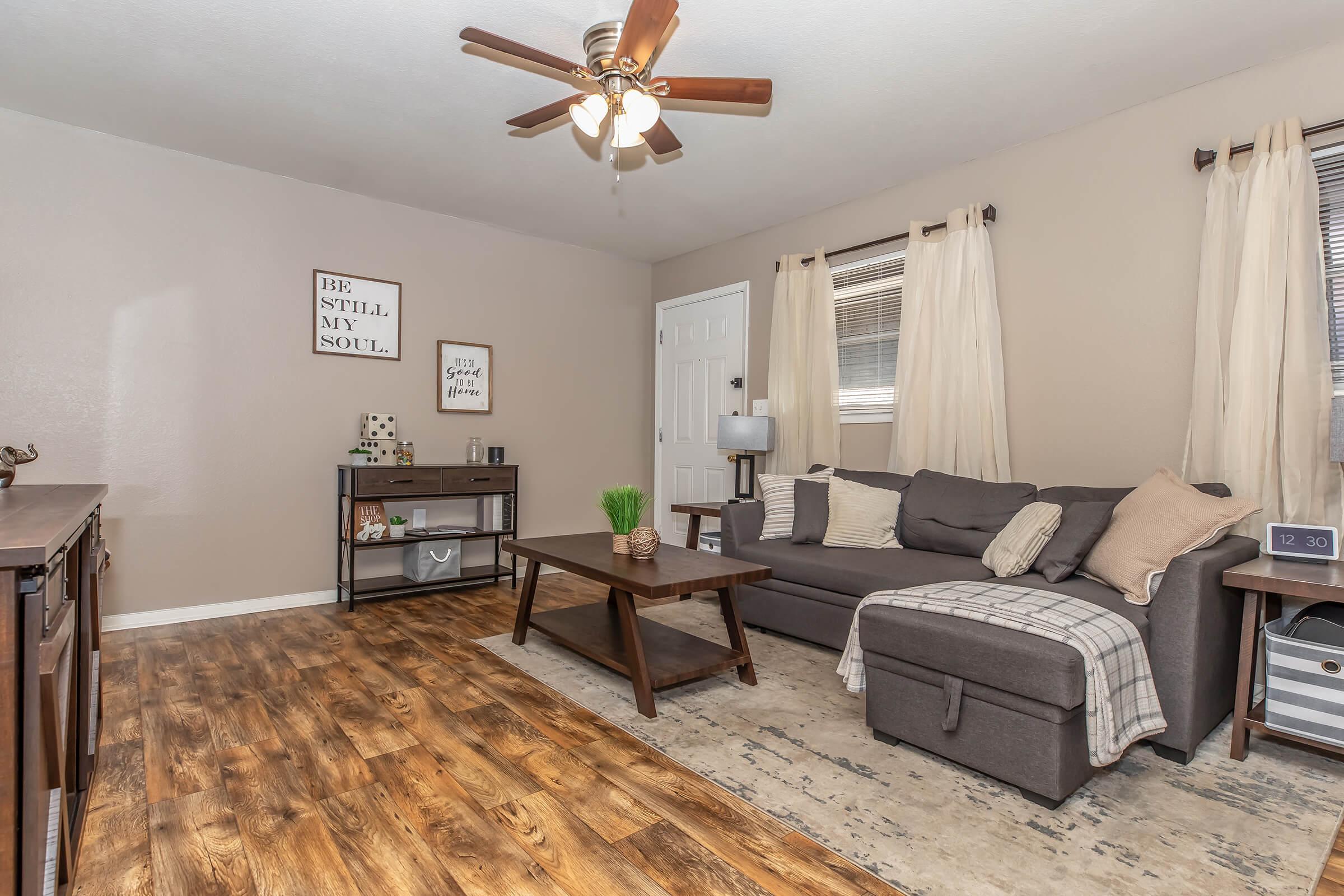 a living room filled with lots of furniture