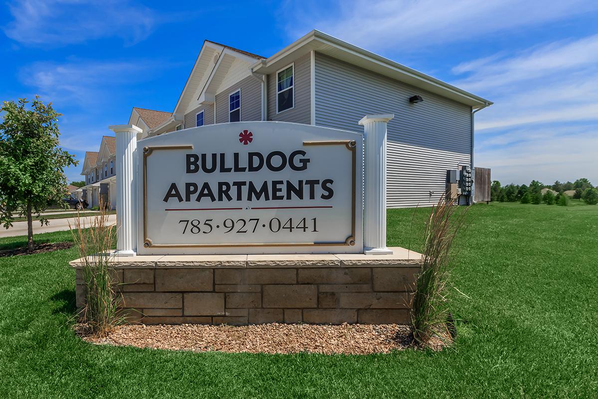 a sign in front of a house