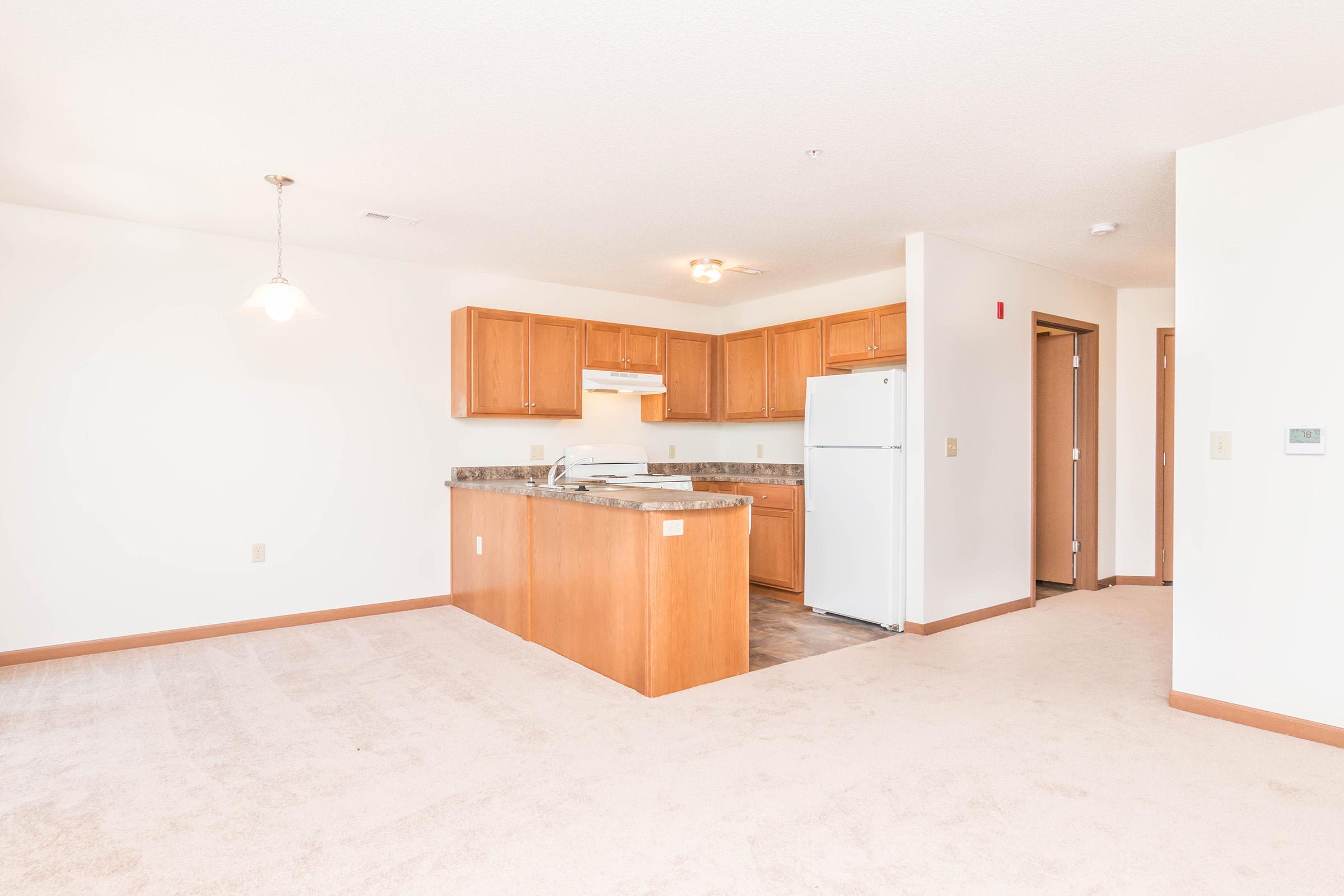 a kitchen with a wooden floor