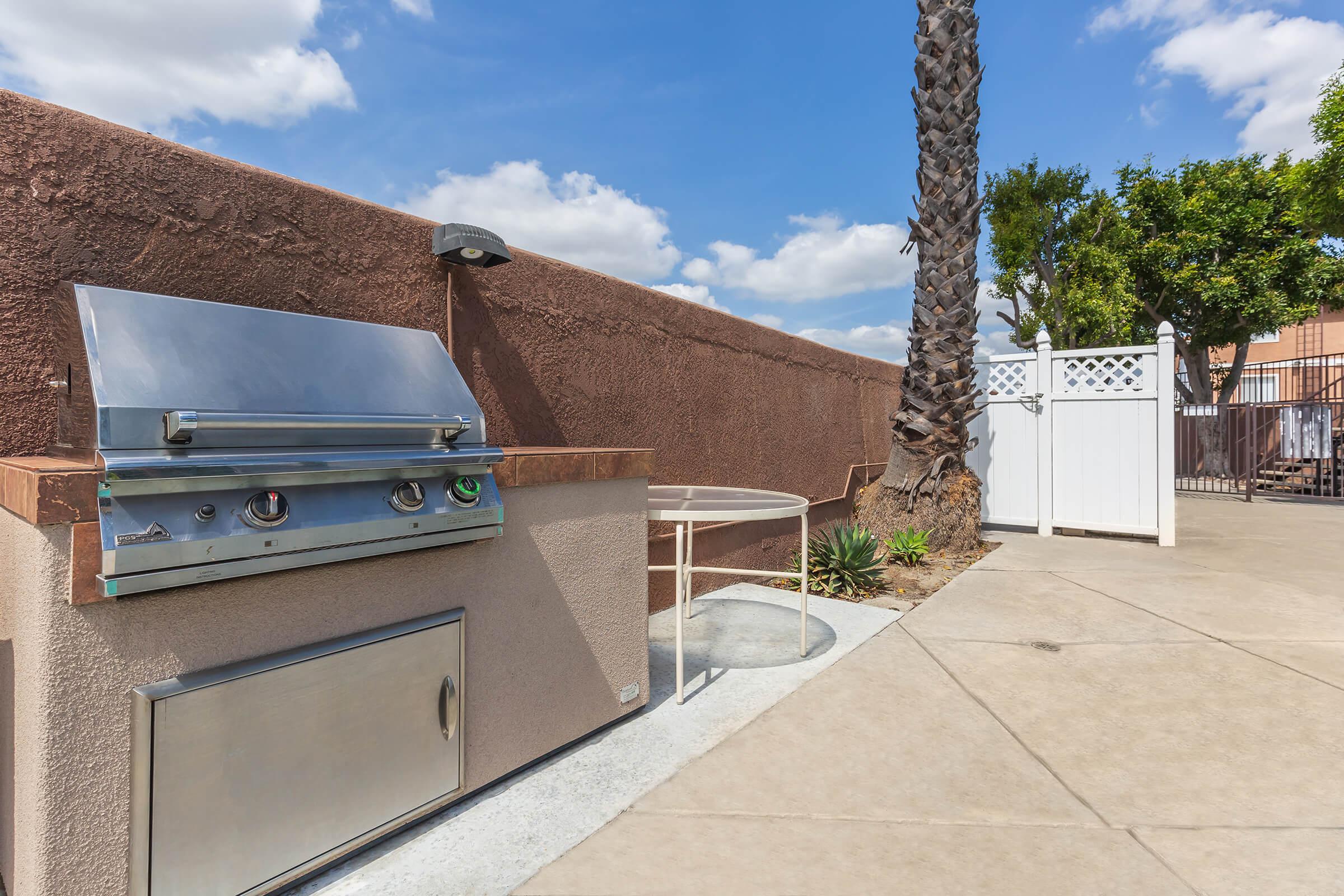 Stainless steel barbecue and table