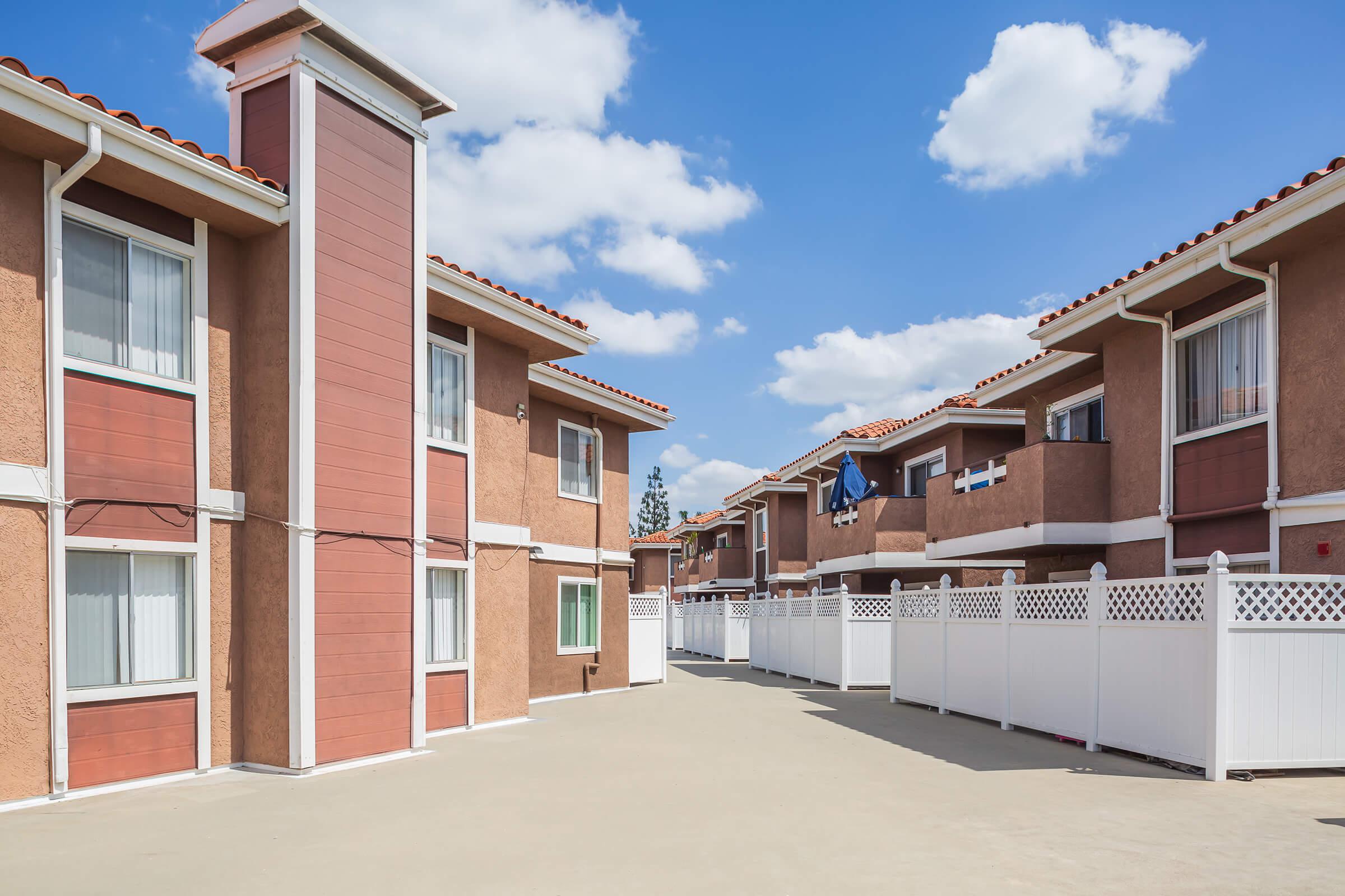 Community buildings with white fences