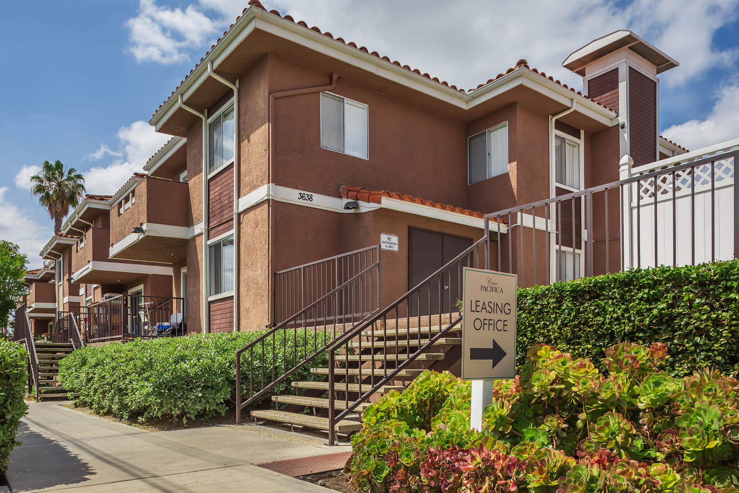 Casa Pacifica Apartment Homes community building with leasing office sign