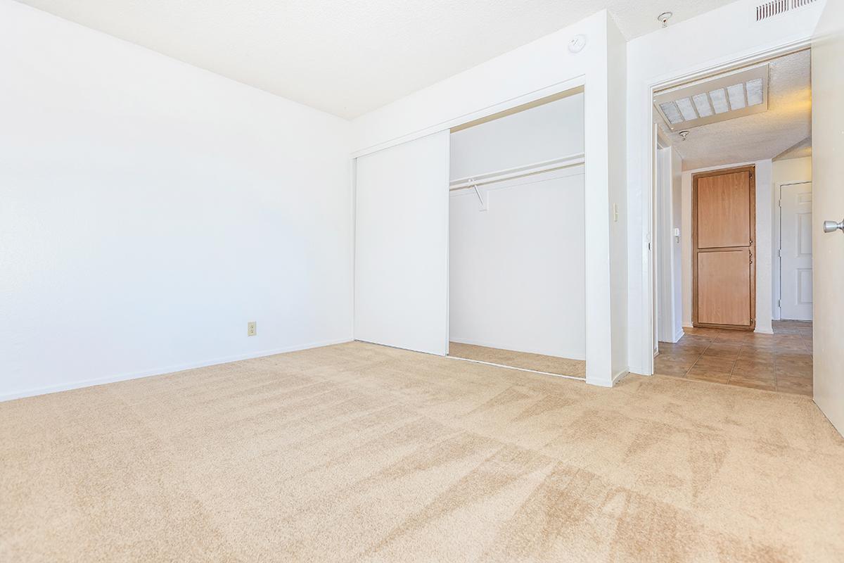 Bedroom with open sliding closet door