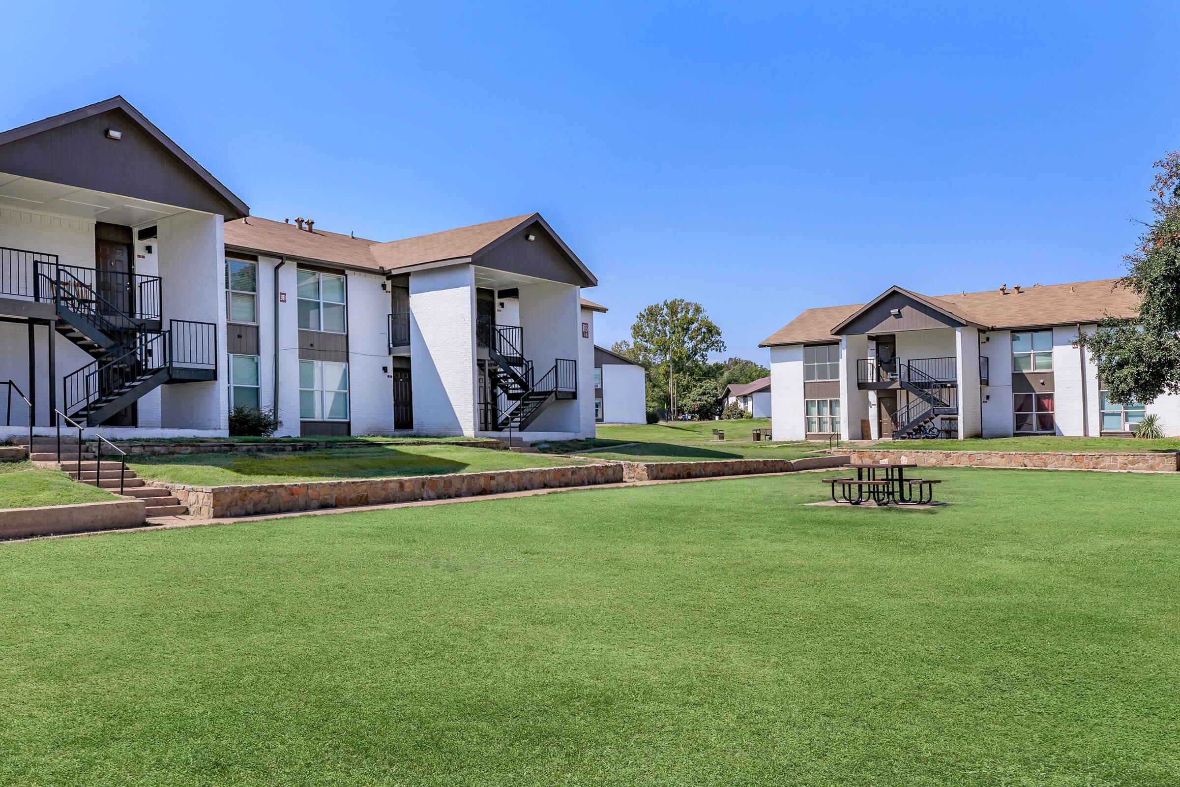 a large lawn in front of a house