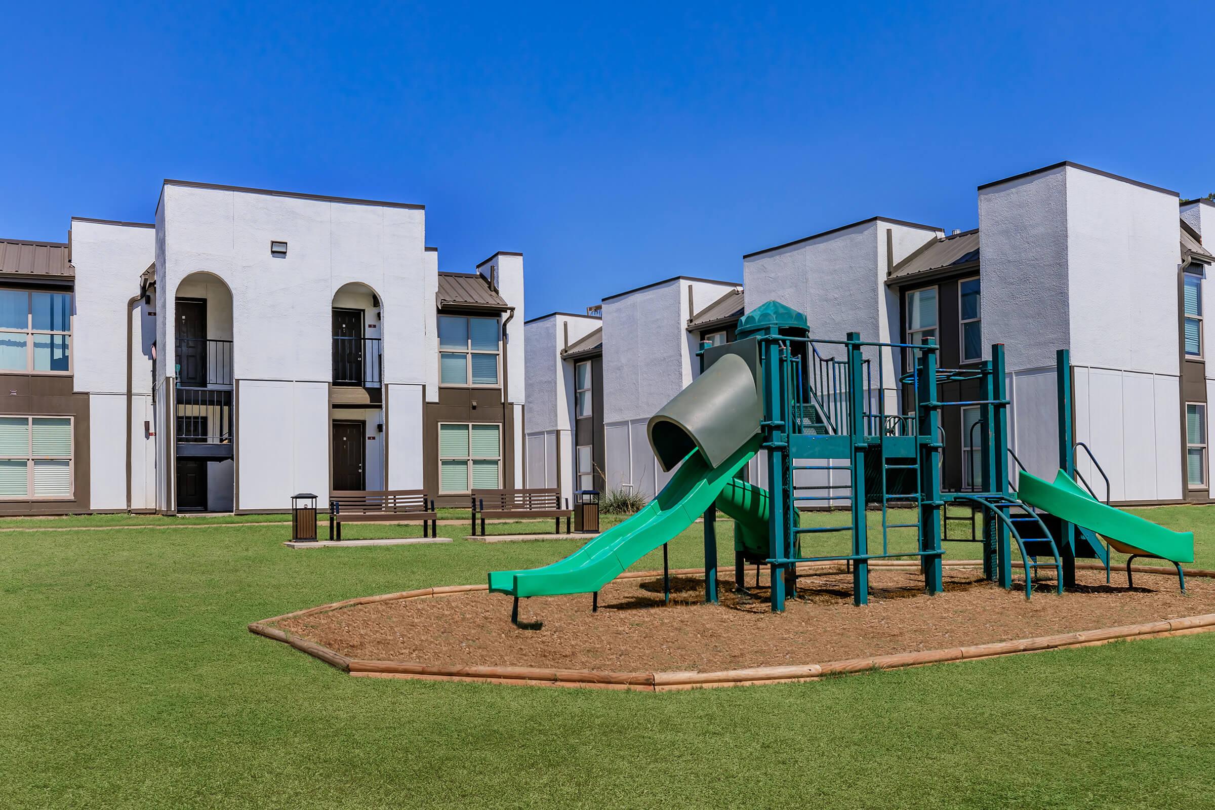 a building with a green lawn chair