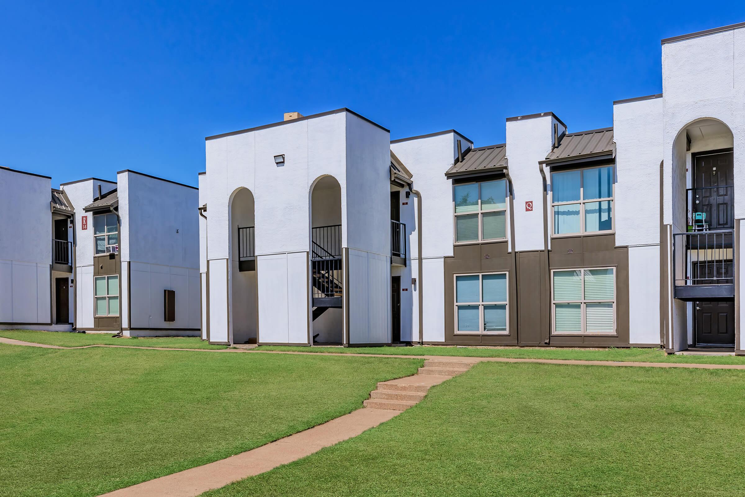 a large lawn in front of a building