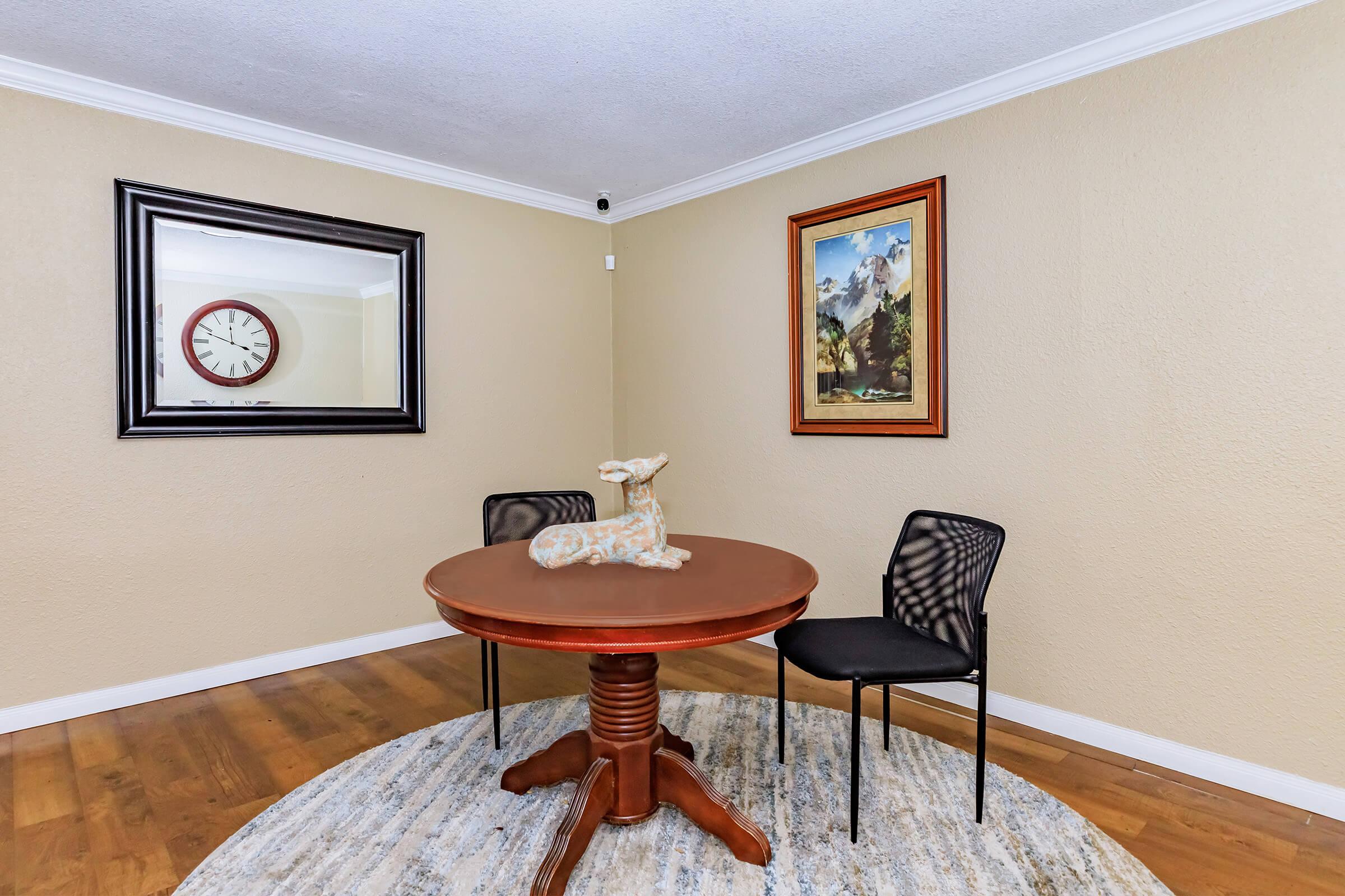 a bedroom with a bed and a chair in a room