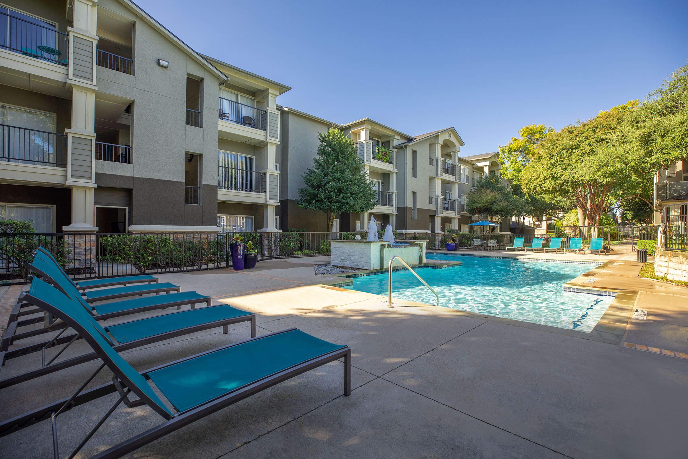 Stone Ridge community pool with blue loungers