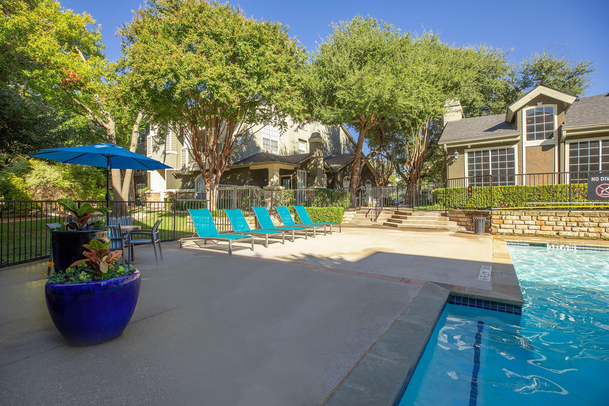 community pool with a blue flower pot