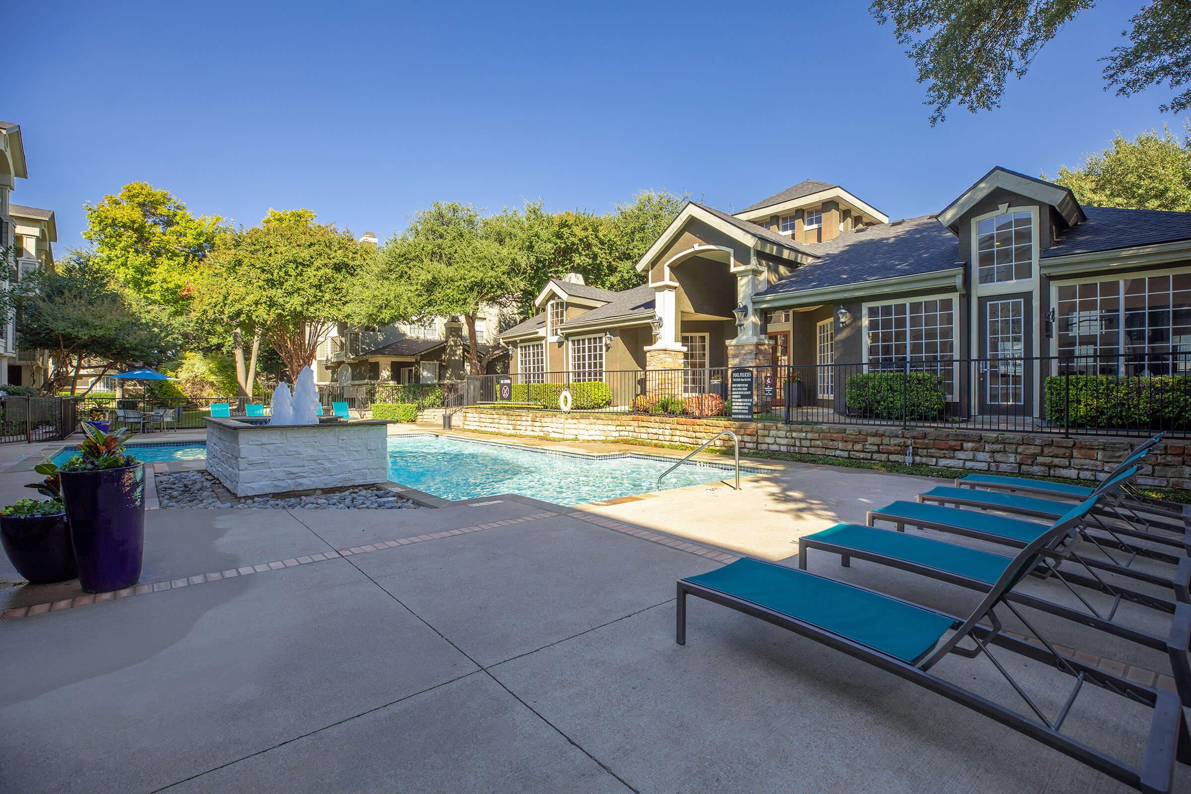 community pool with green grass