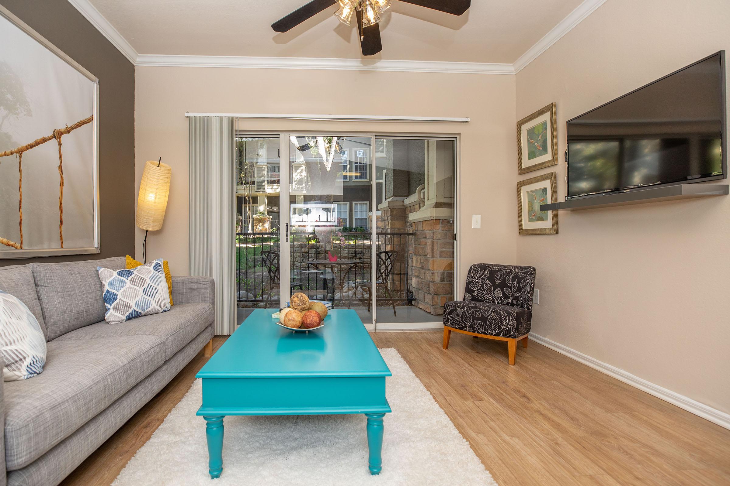 a living room with sliding glass doors