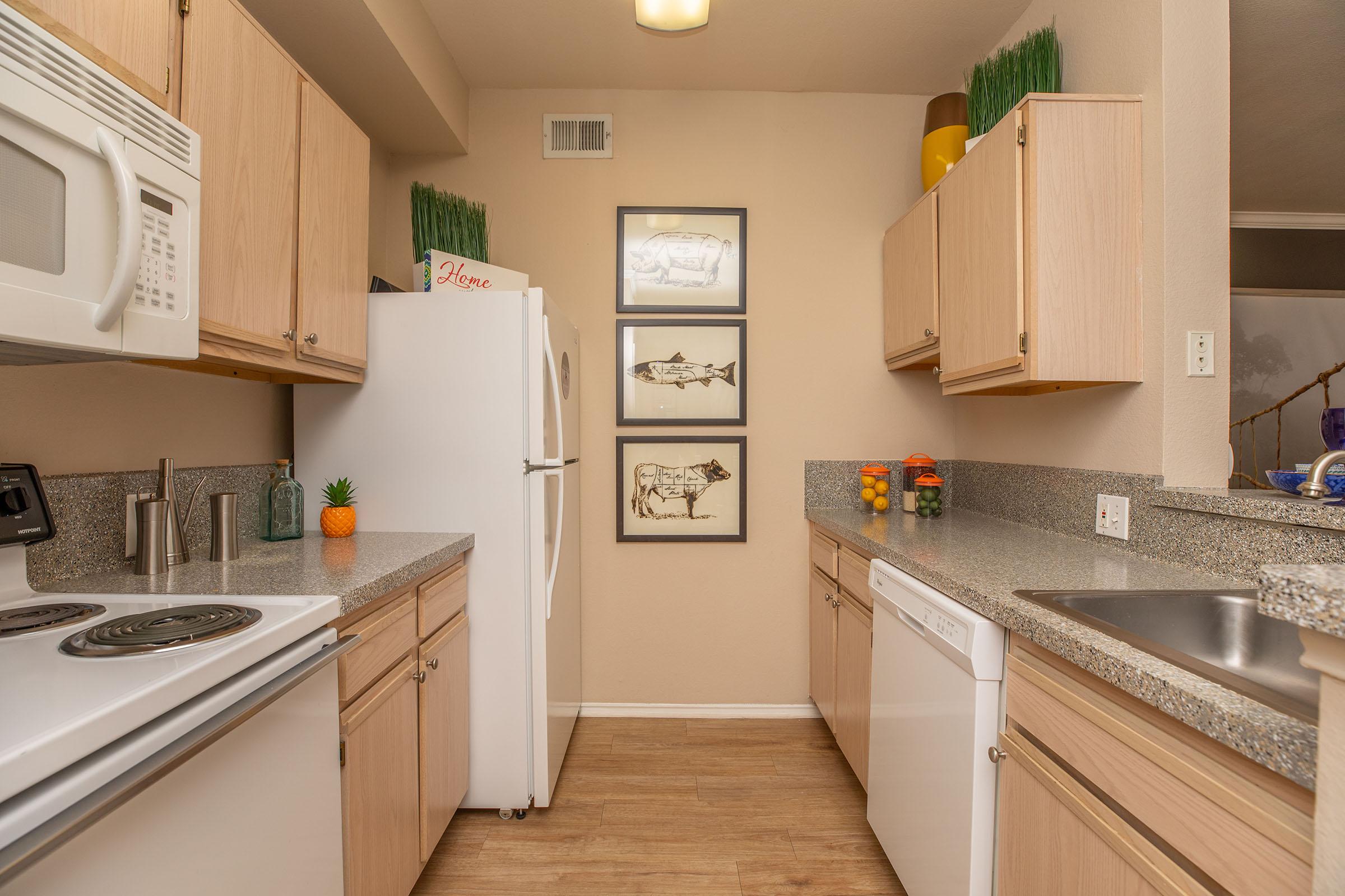 a kitchen with white appliances