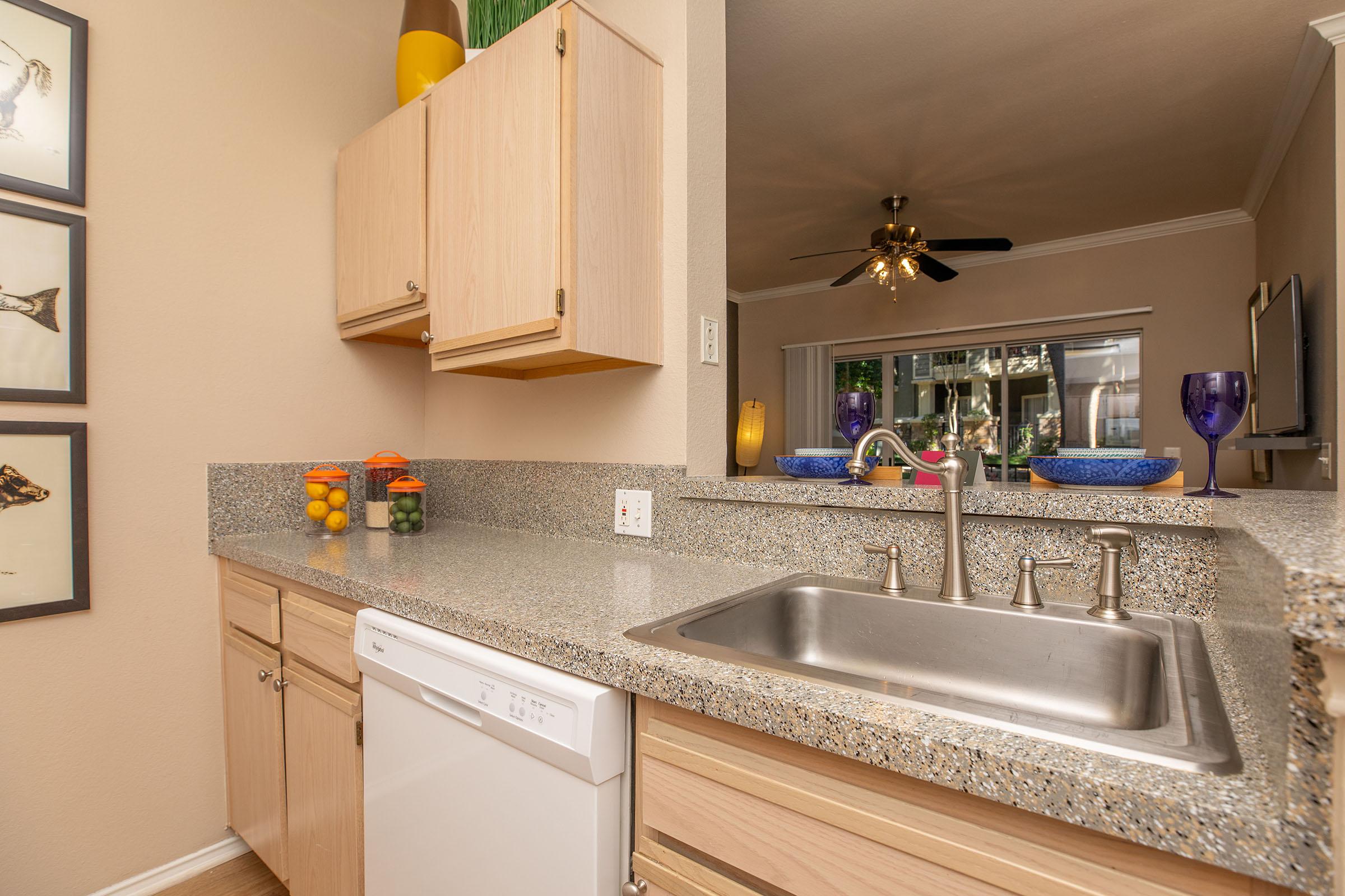 a kitchen with a metal sink