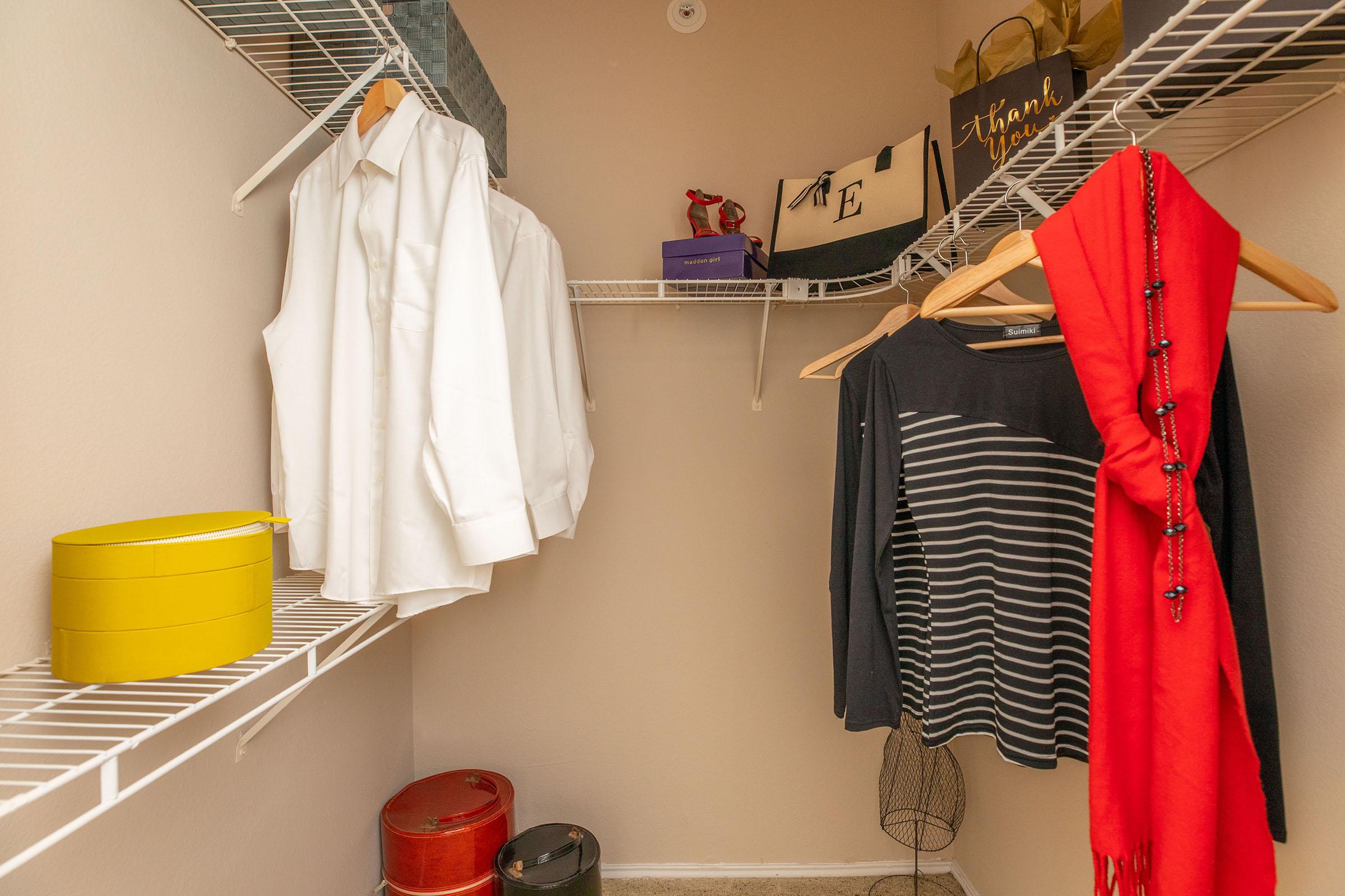 a furnished walk-in closet