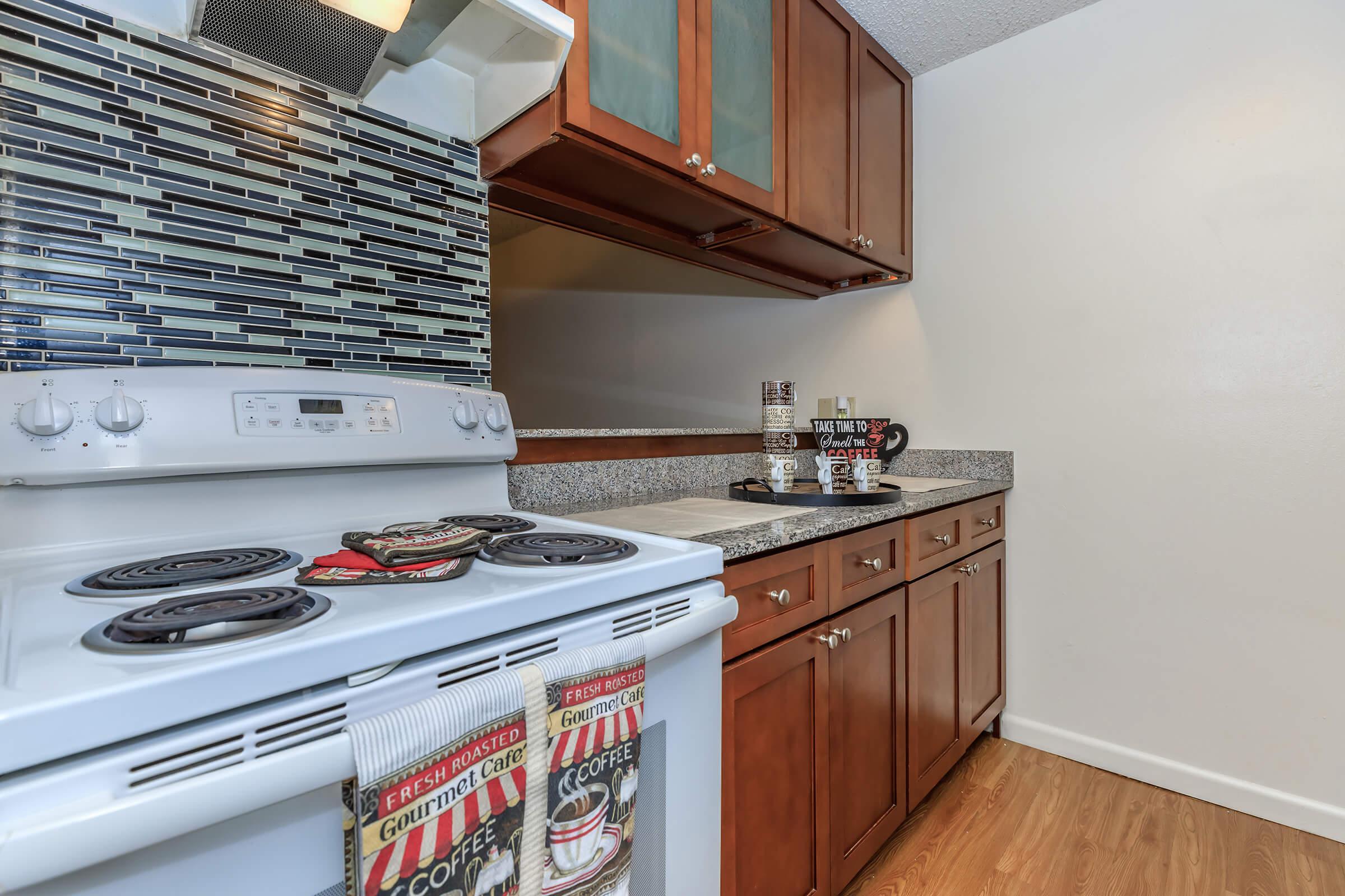 a kitchen with a stove oven and refrigerator